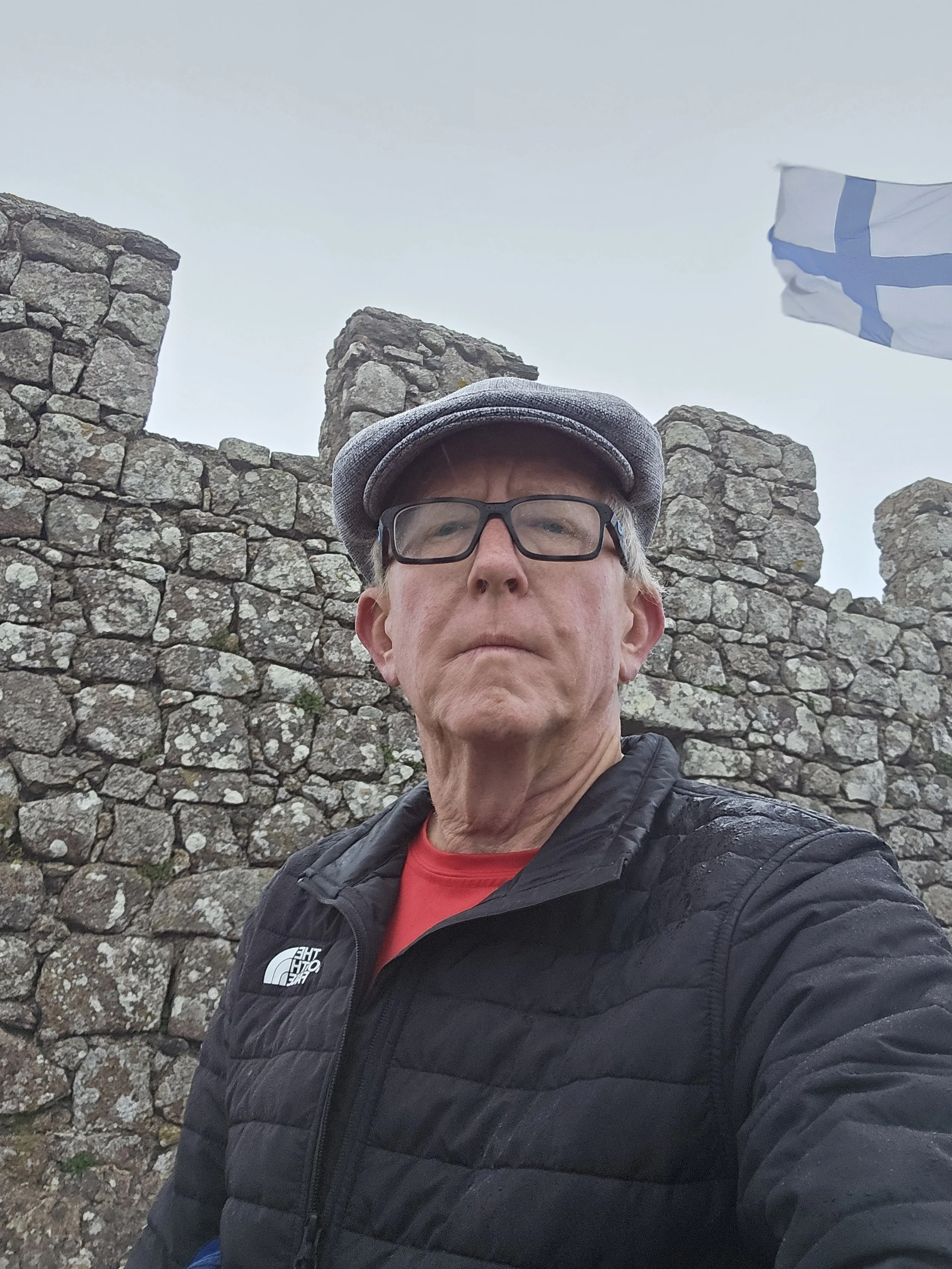 portrait of Jonathan Grinder in front of a castle