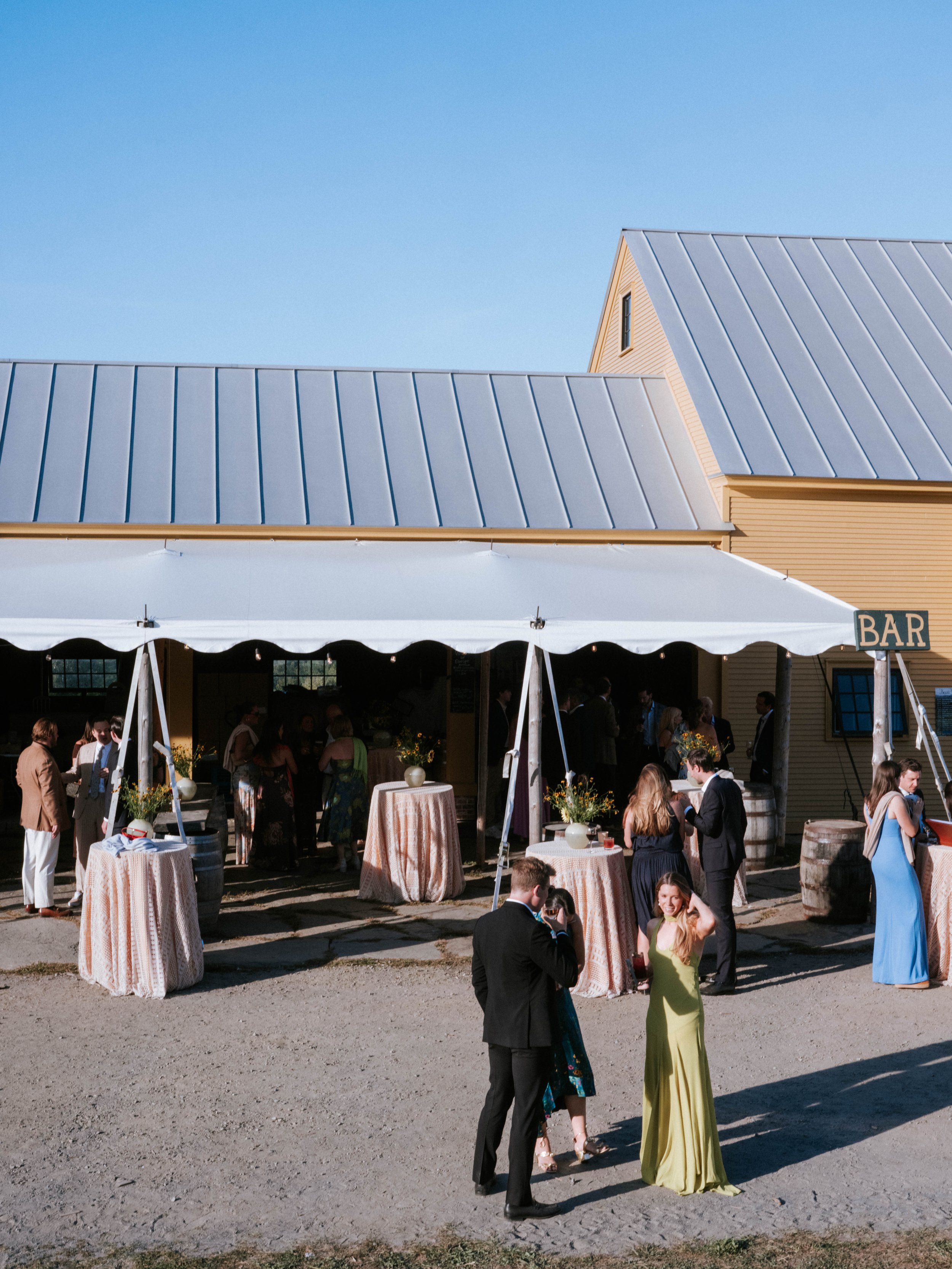 cocktail hour set up with tables outside the bar