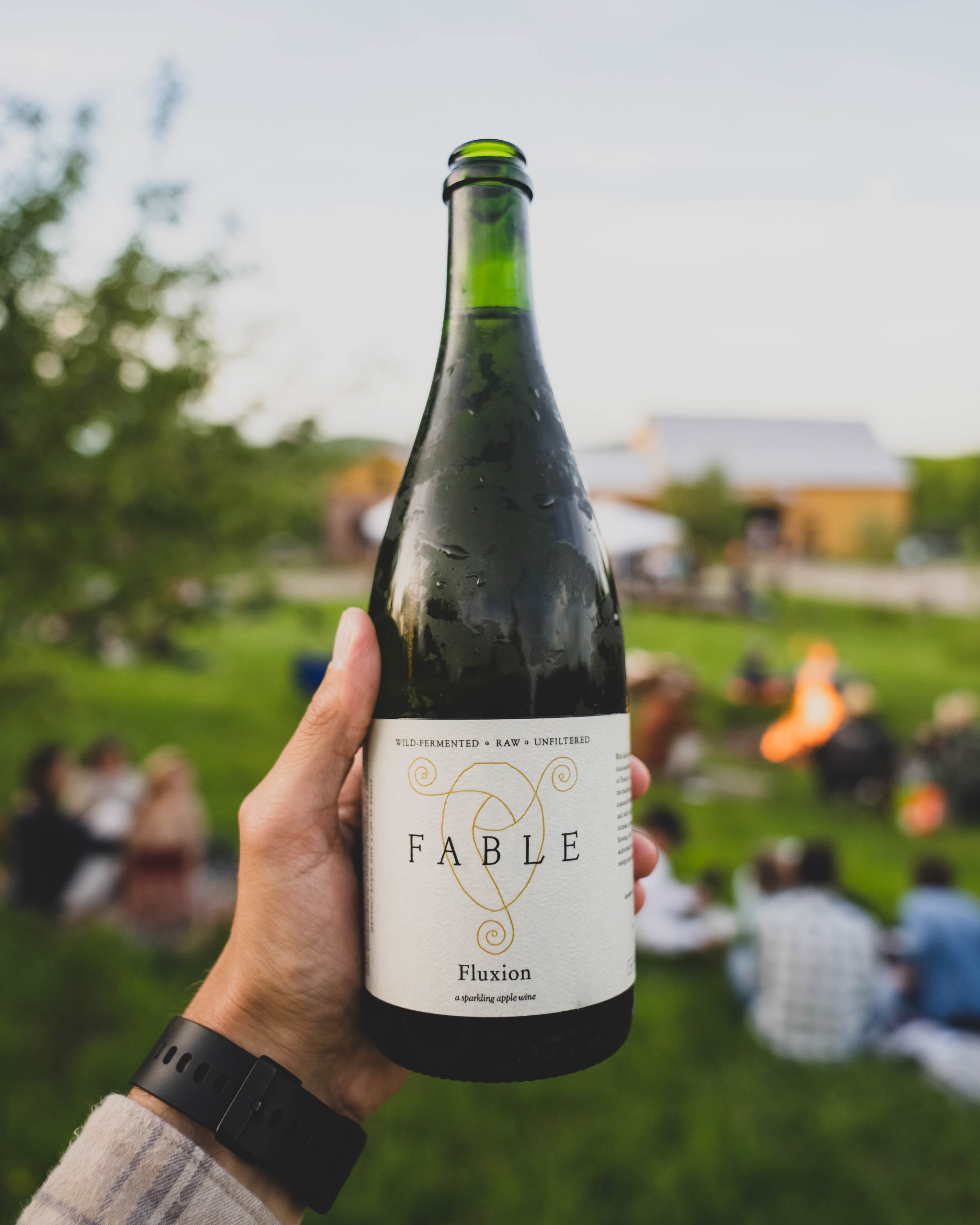 a bottle of fluxion cider at feast and field