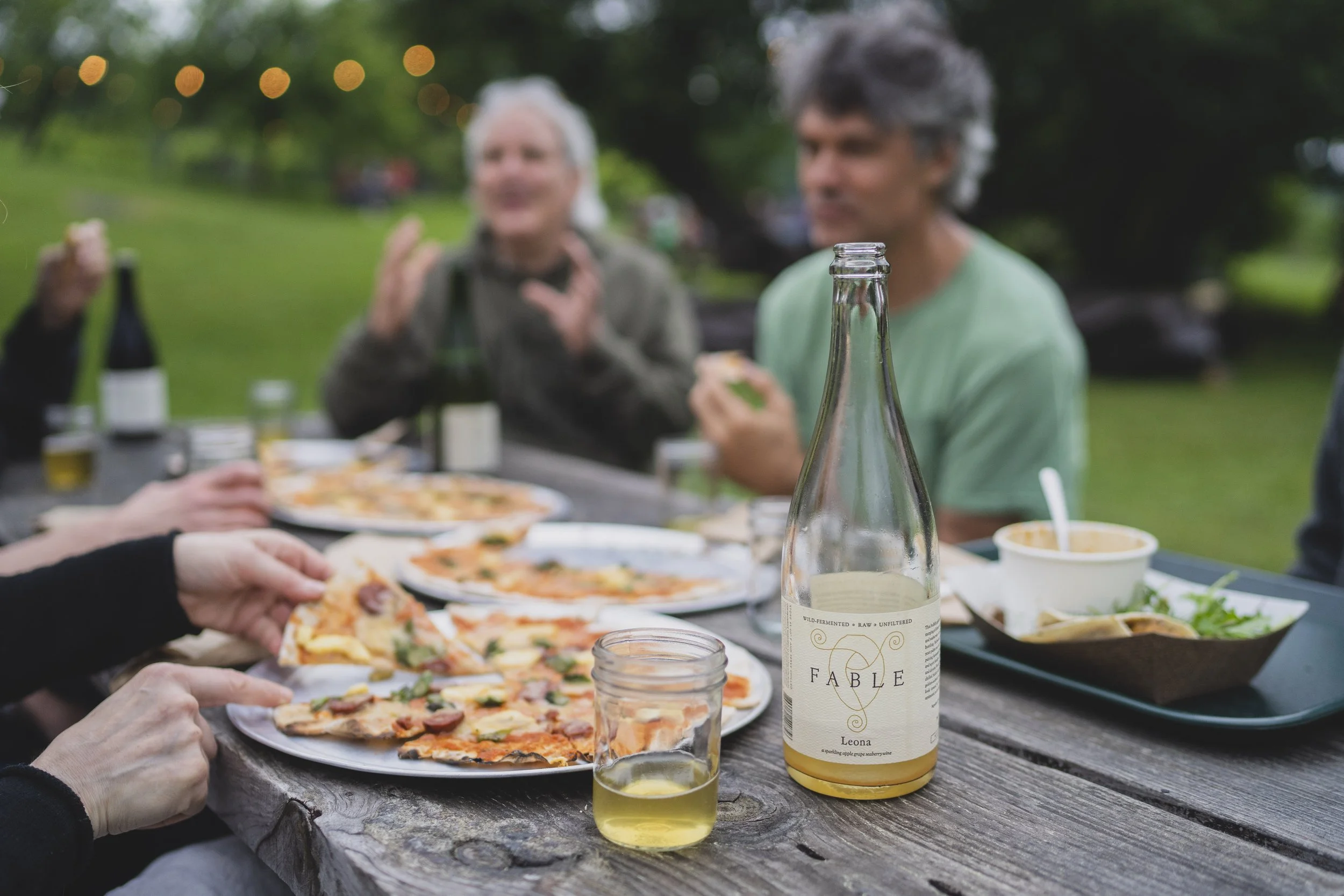 community enjoying their meals at feast and field