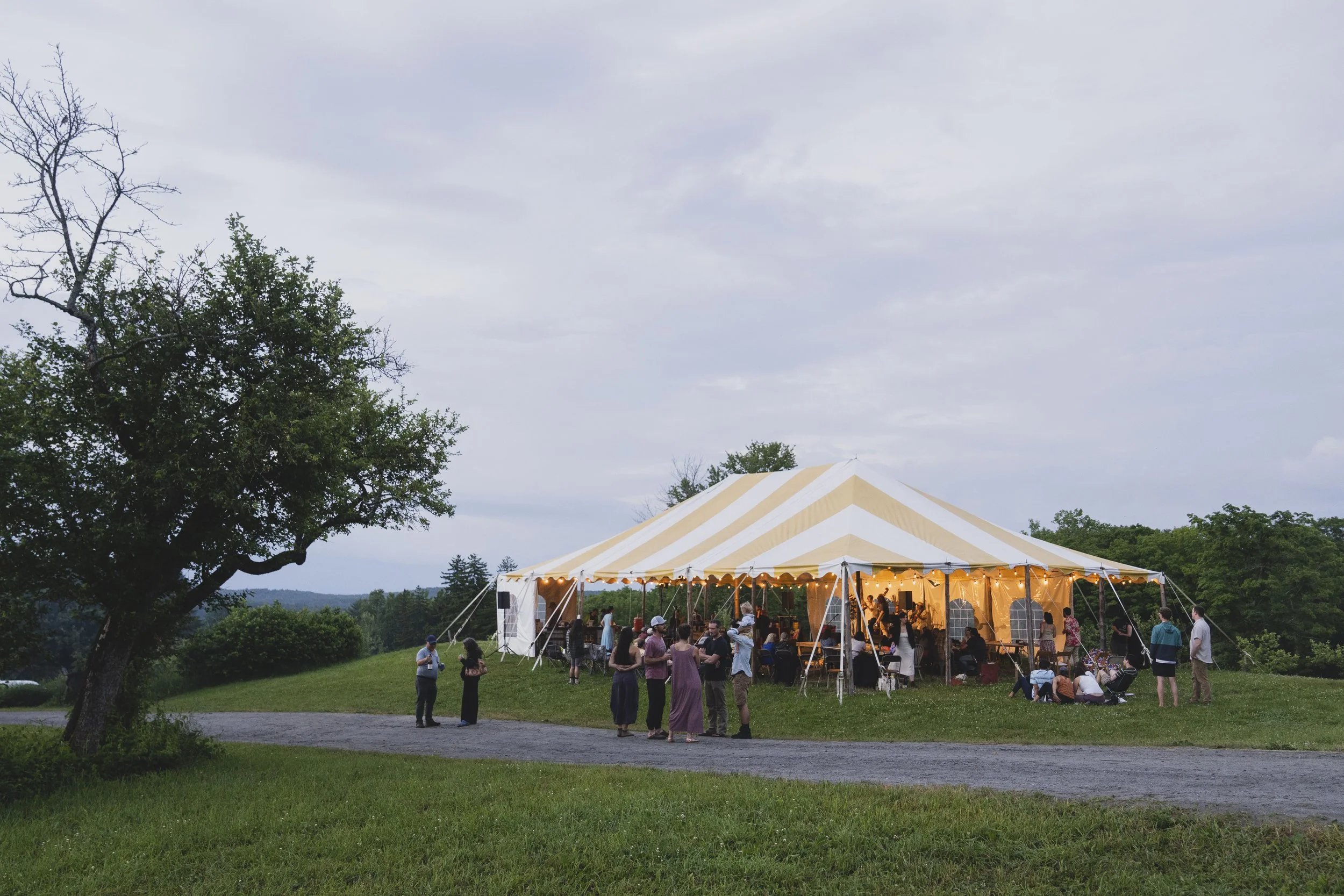 our yellow and white tent in case of rain set up during the summer for feast and field