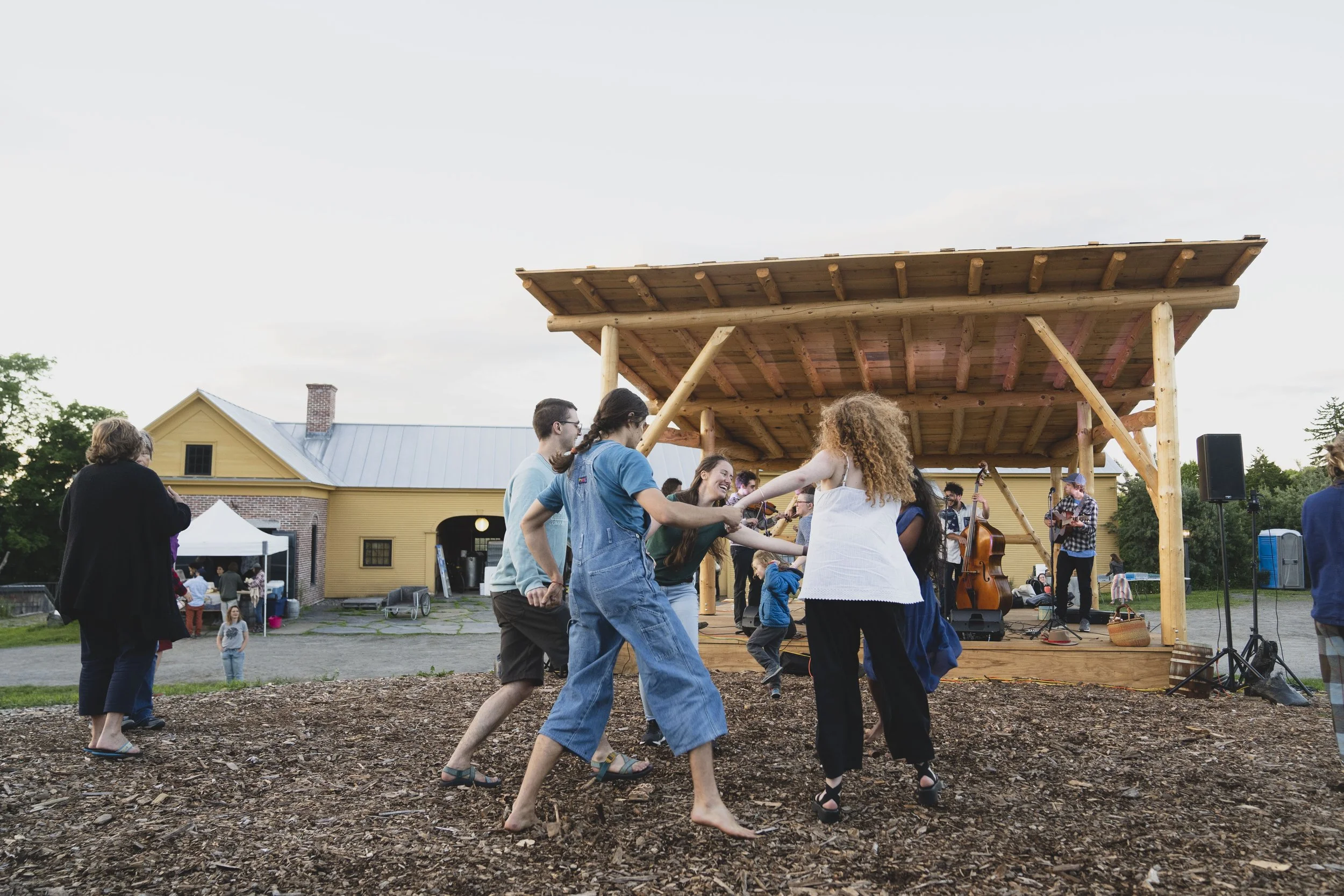 community dancing at feast and field in front of our multi use pole barn