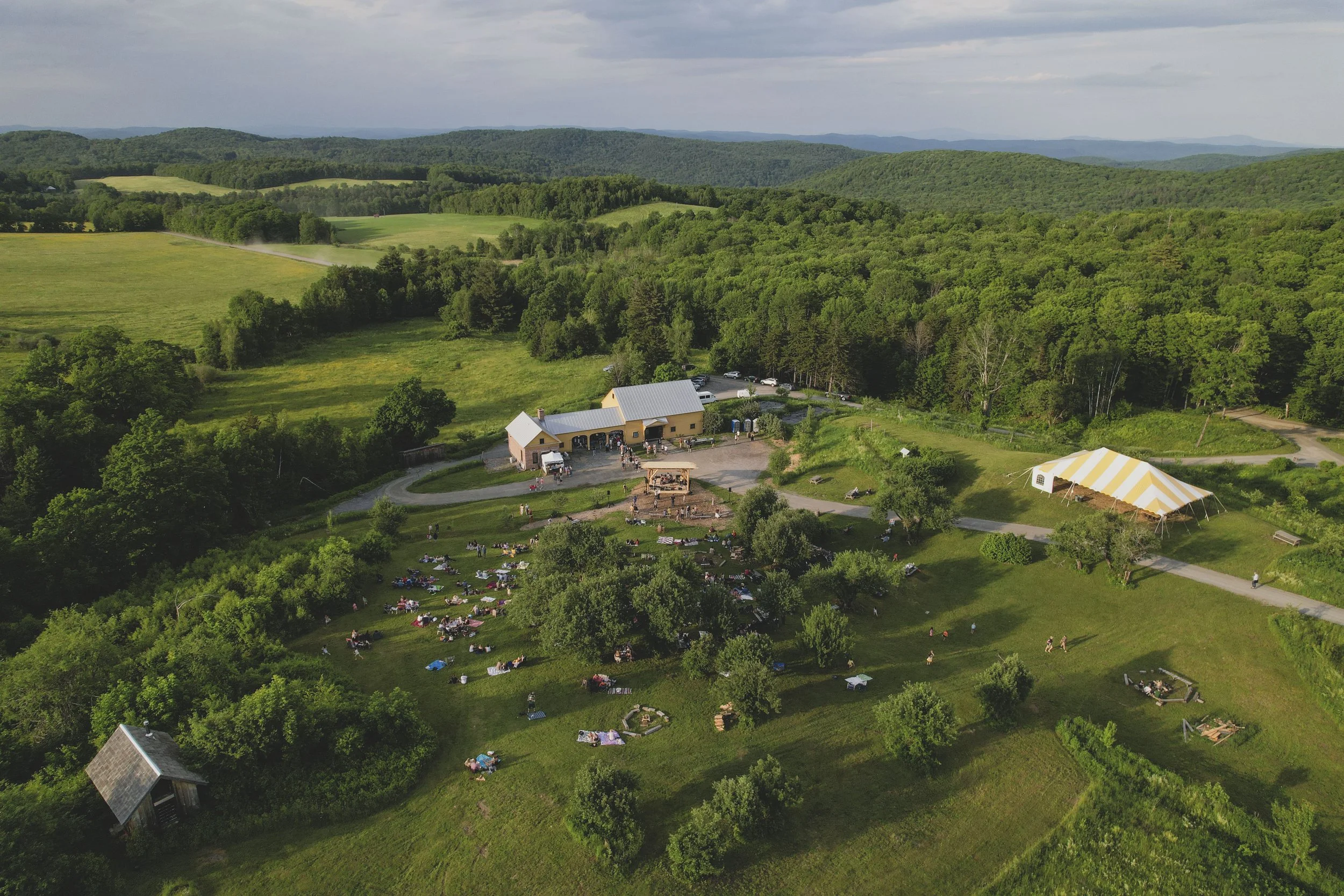 overhead drone shot of fable farm fermentory and the historic clark farm in the background during feast and field
