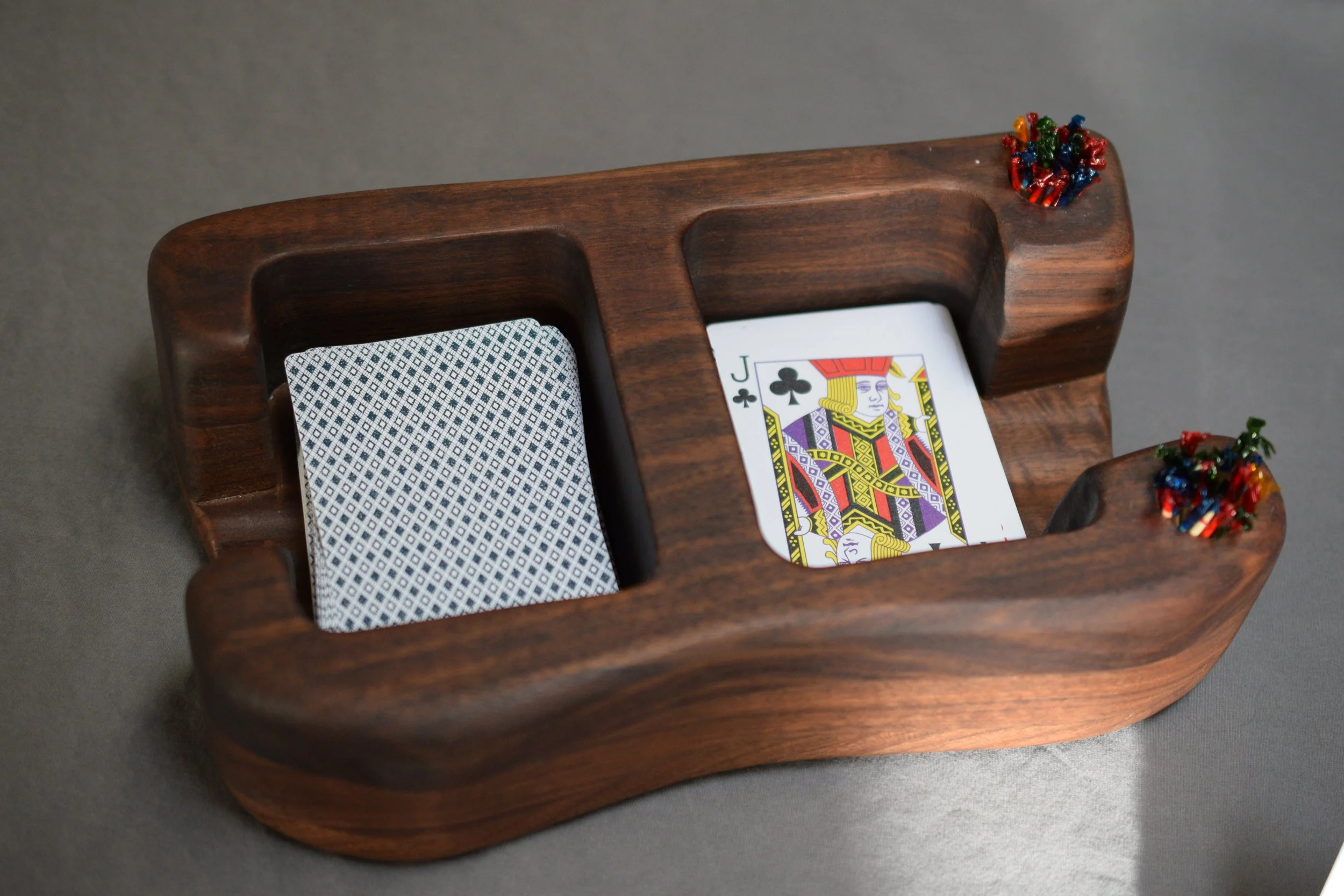 Card holder for games will hold 2-3 decks at once on each side. Made from Walnut.