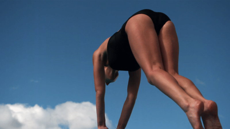 A woman does a flip in the air
