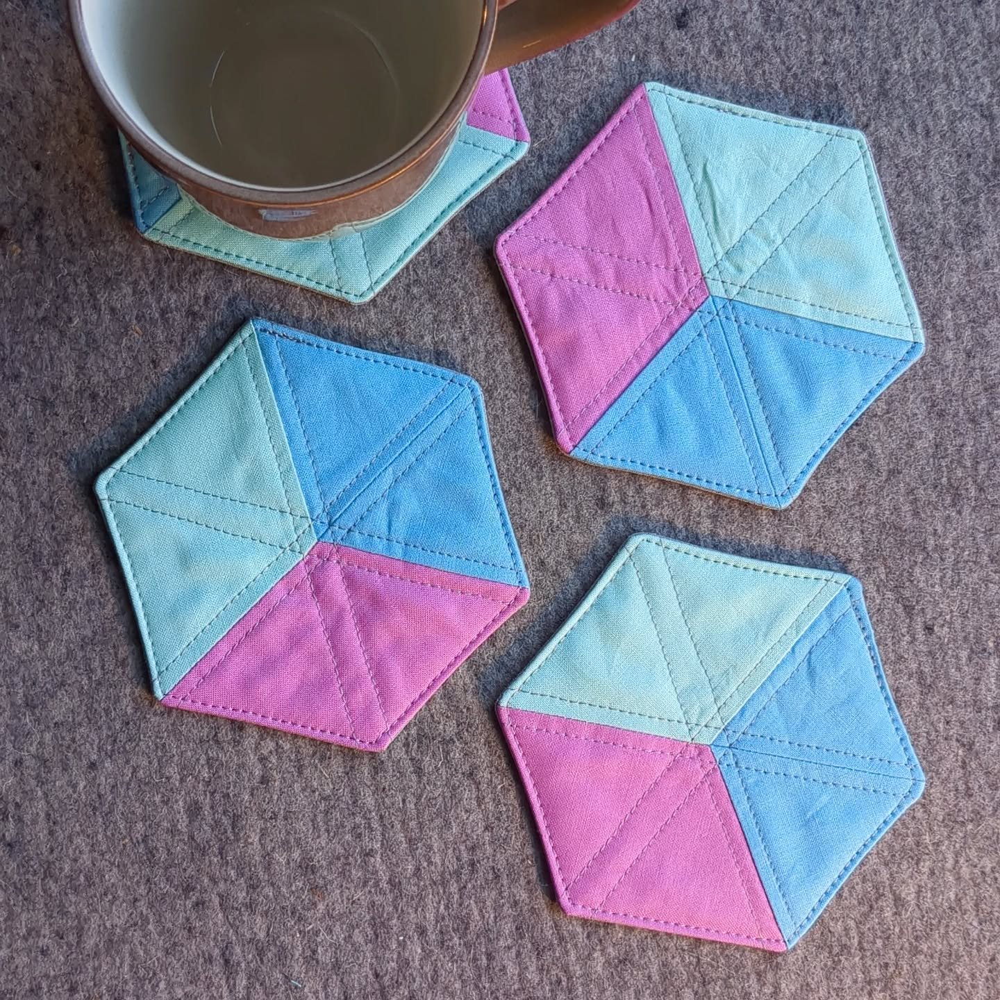 Working on some new coaster sets! These will be available in a variety of colors at our upcoming markets, and on our website shortly! 

#quiltersofinstagram #fabriccoasters #seattlemakers #shopsmall #pastel #hexagonal #geometric #homegoods