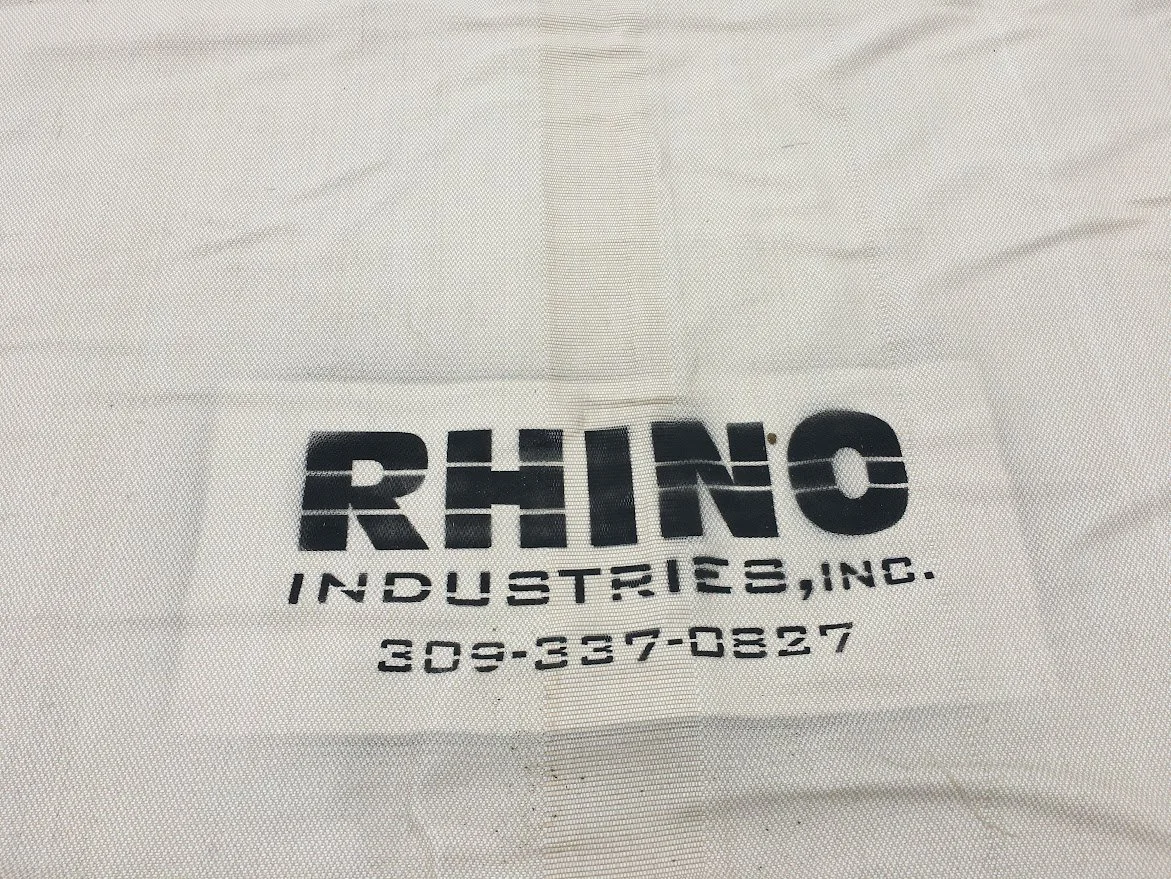 White fabric with black printed text that reads 'RHINO INDUSTRIES, INC. 209-337-0827'.