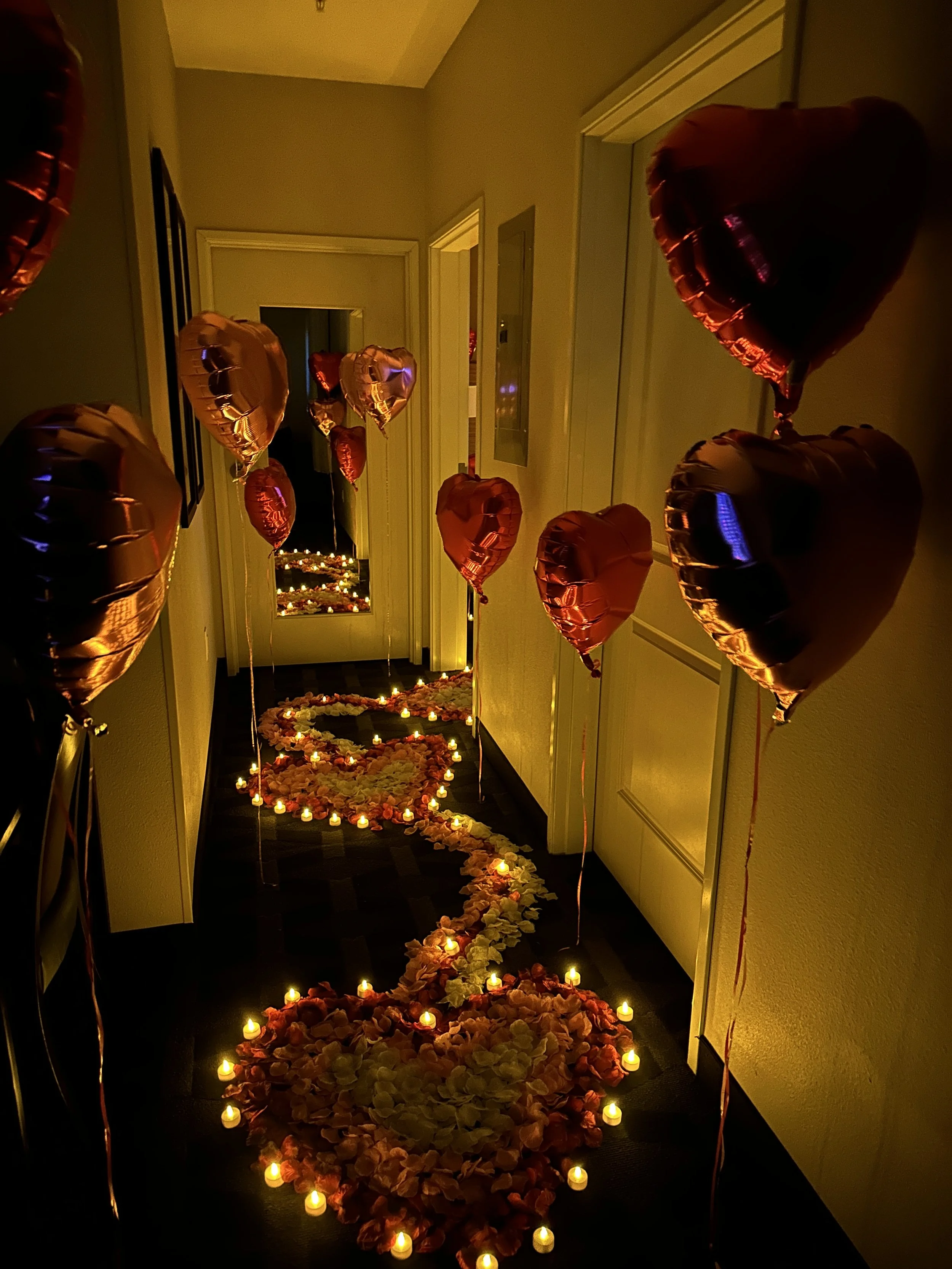 Hallway decorated with rose petals and candles