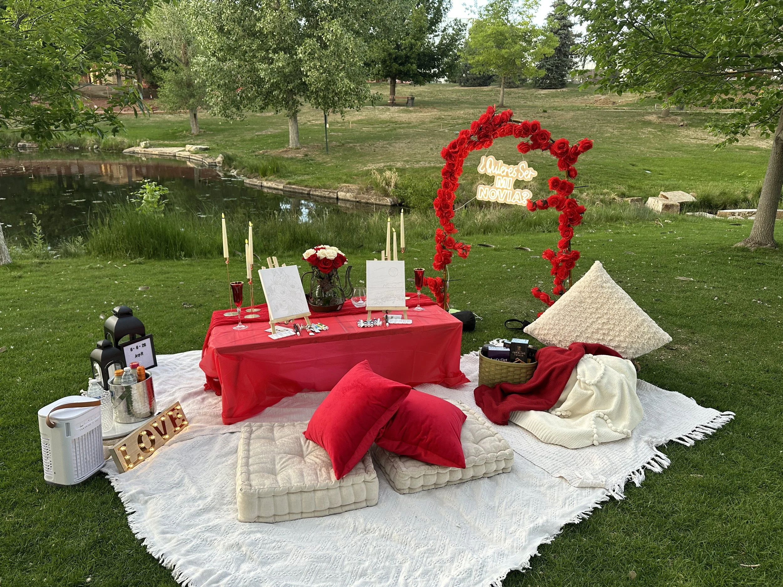 Celebratory bedroom decorated for a 35th birthday with blue and silver balloons, large number balloons '3' and '5', a bouquet of red roses, and a 'Happy Birthday' banner in the background at an Airbnb in Denver, co