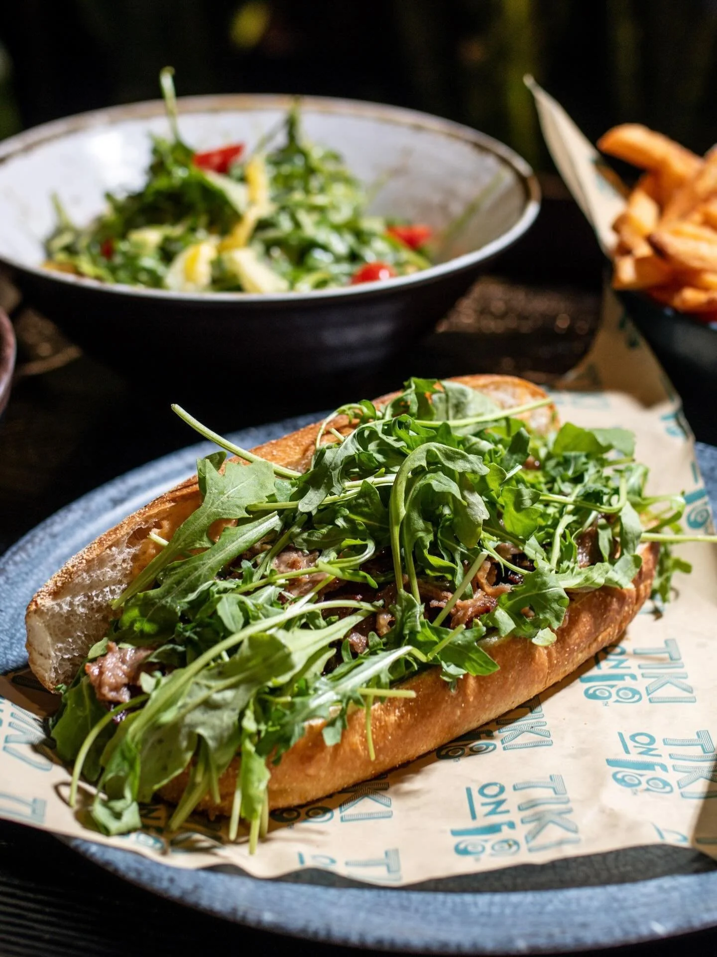 Shaved ribeye, melty provolone, onions, arugula, and chili-horseradish aioli on a hoagie roll&hellip; this handheld means business.
