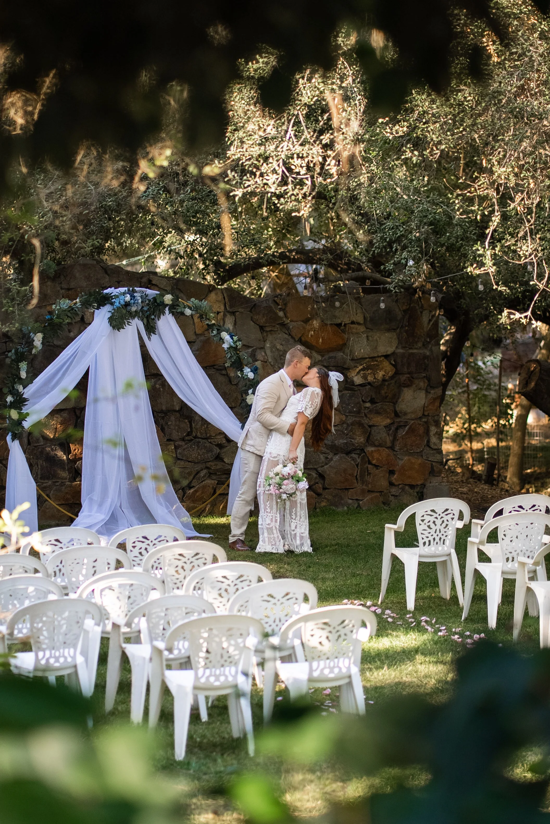 Bride & Groom Kissing Near Alter