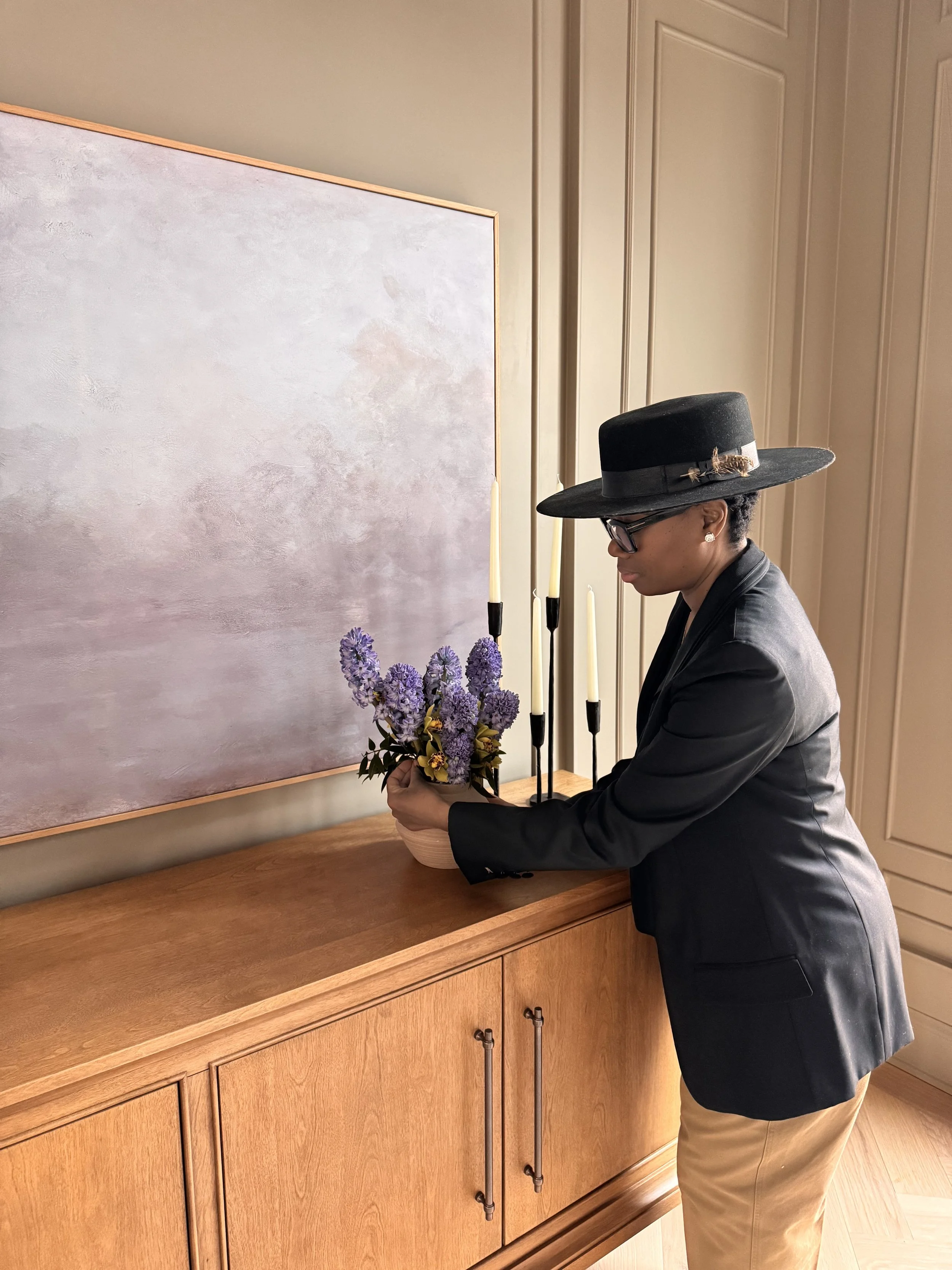Lavish Leaf founder editing floral arrangement for styled shoot