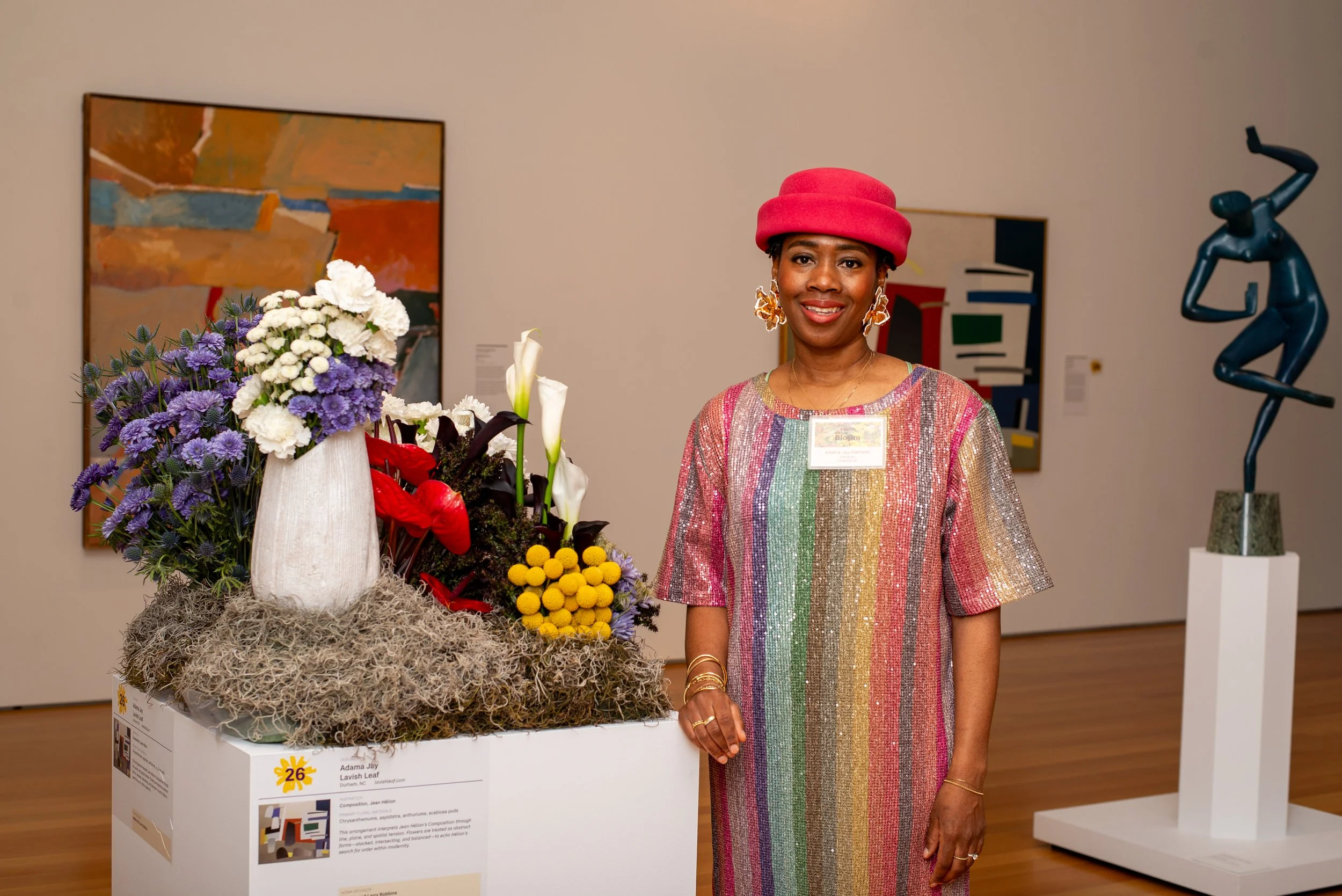 Floral designer in front of podium floral design