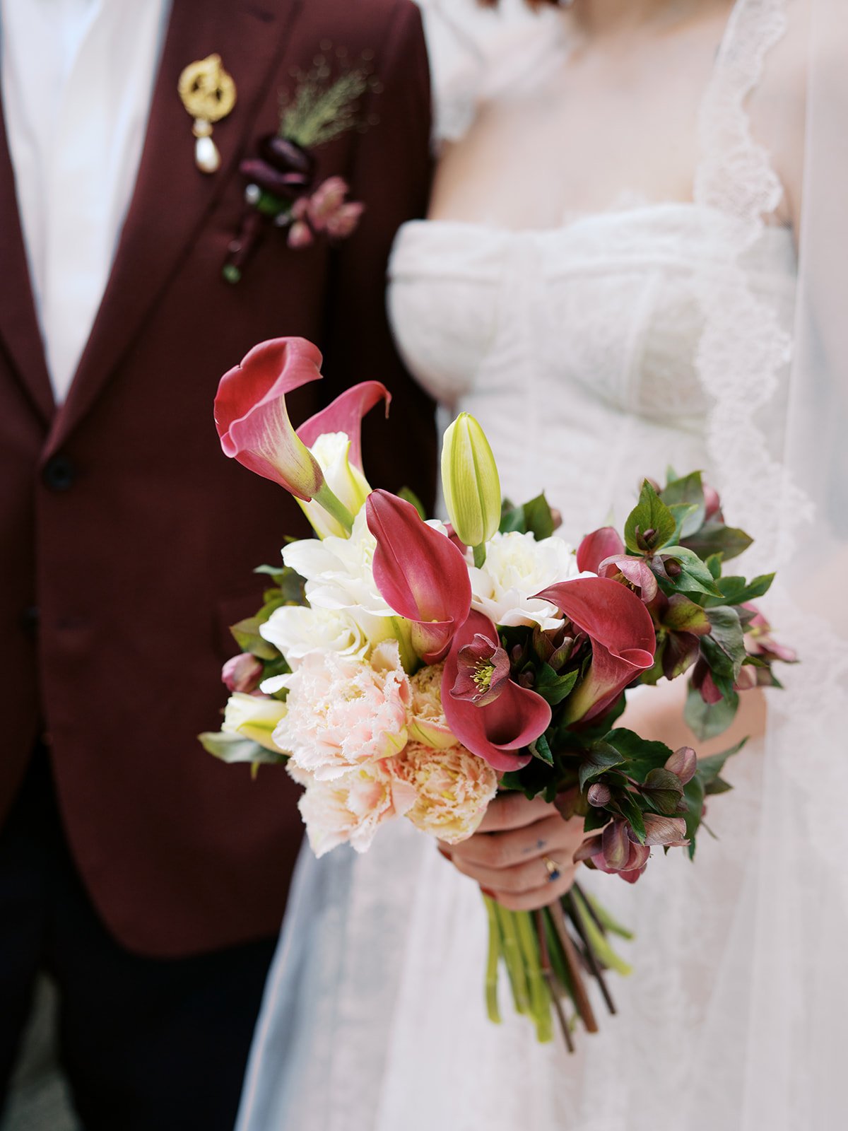 Close-up of a sculptural wedding bouquet highlighting layered floral textures, natural movement, and contemporary bridal floral design.