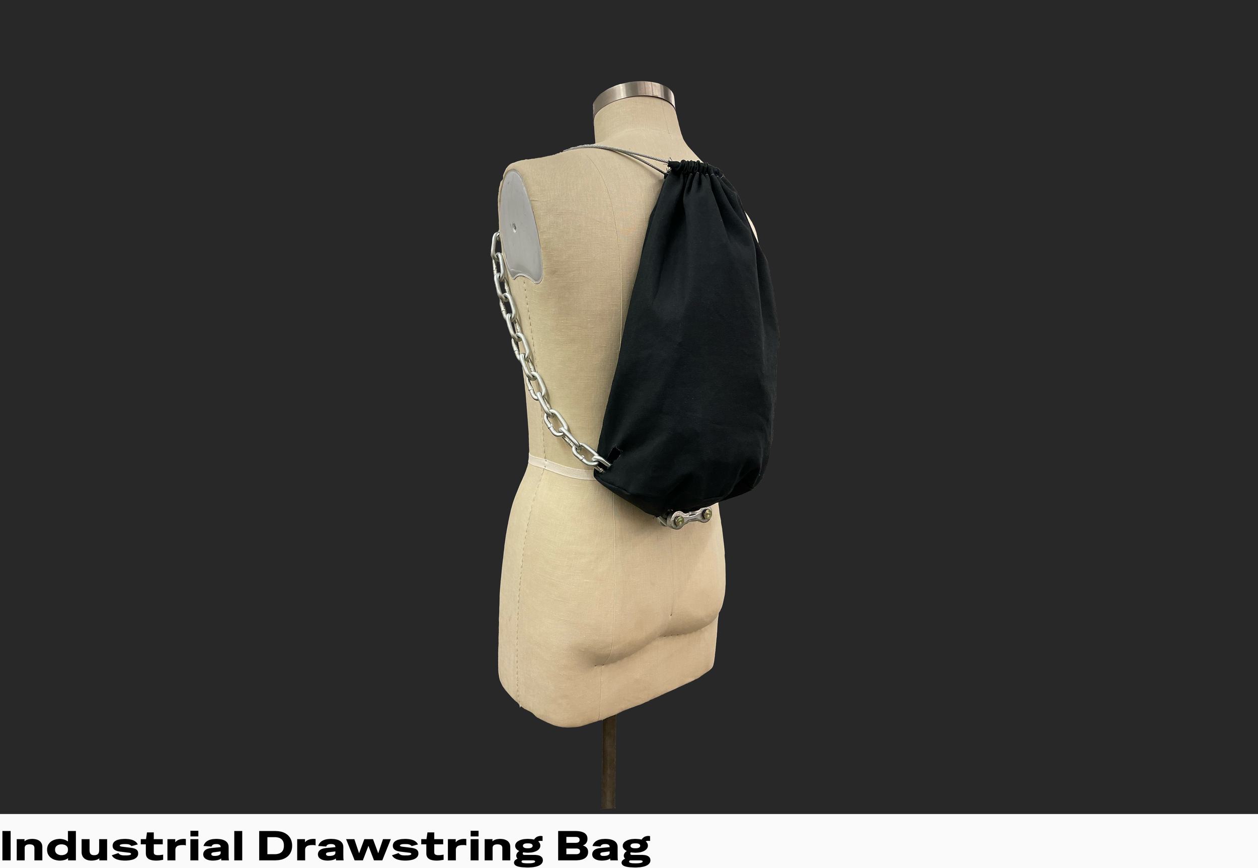 I found that although I enjoy the convenience of drawstring bags, I have a few issues with how they interact with the human body. I used large metal chain-links as "straps" for the bag because their weight and width prevent shoulder slipping. I disco