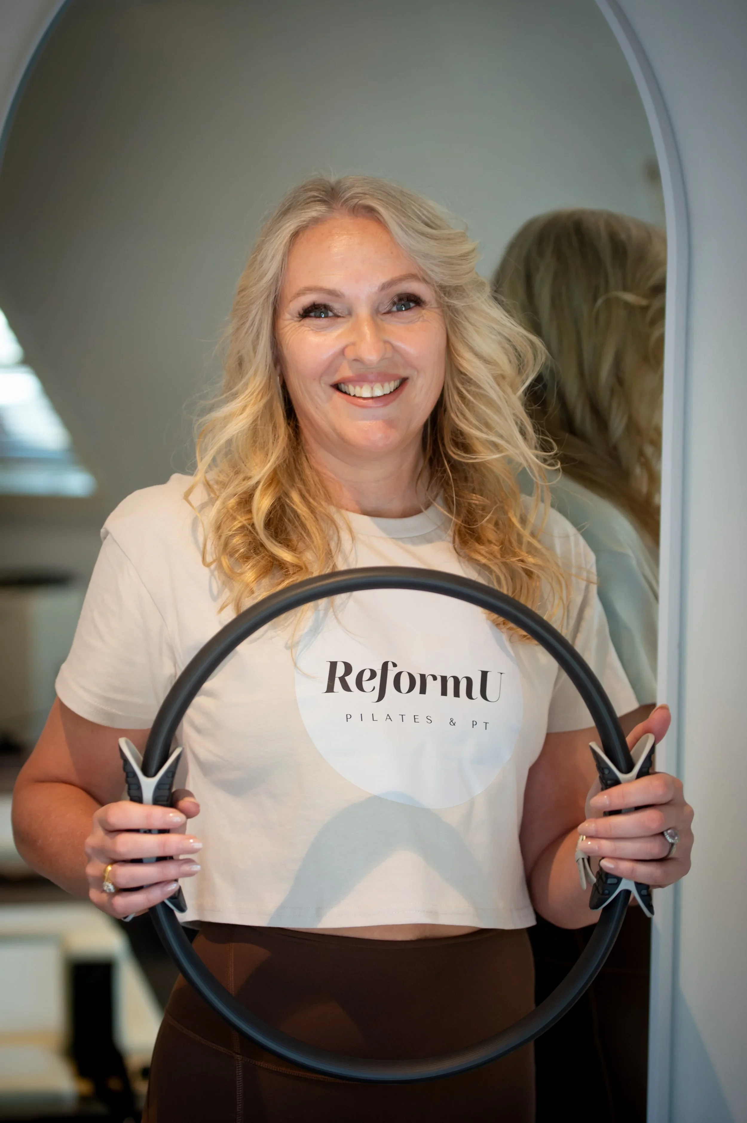 Christine smiling supportive private trainer at reformer pilates studio in Wahroonga