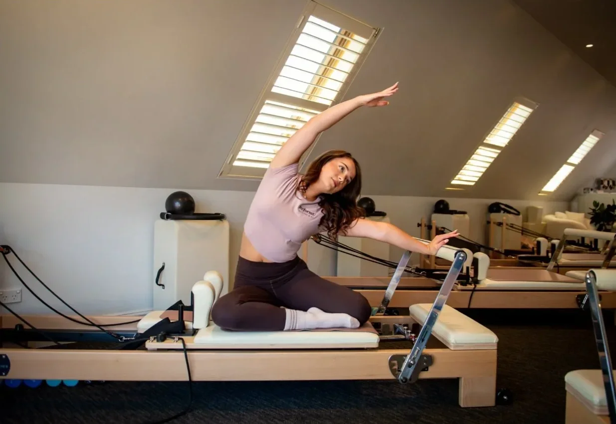 Young woman in Pilates reformer class Wahroonga