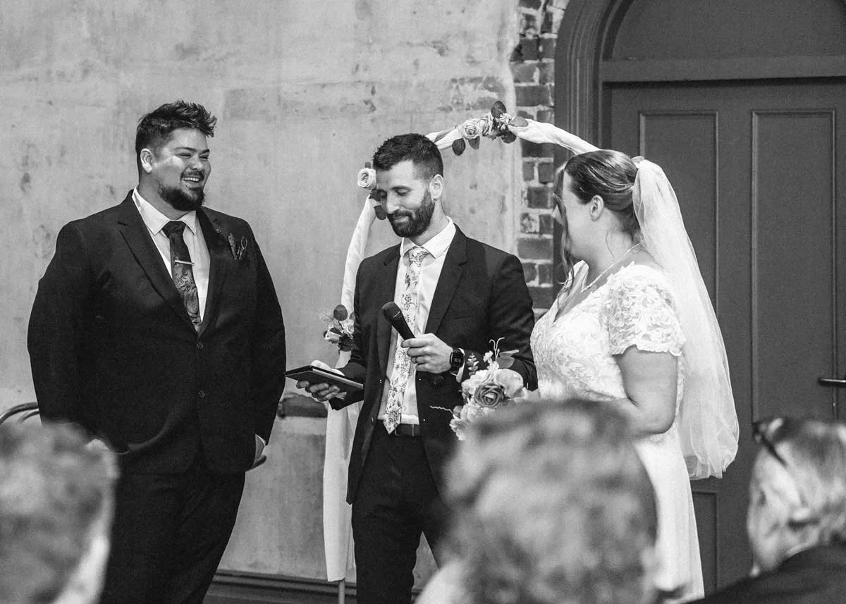 Perth wedding celebrant guiding a bride and groom through their ceremony with laughter and joy.