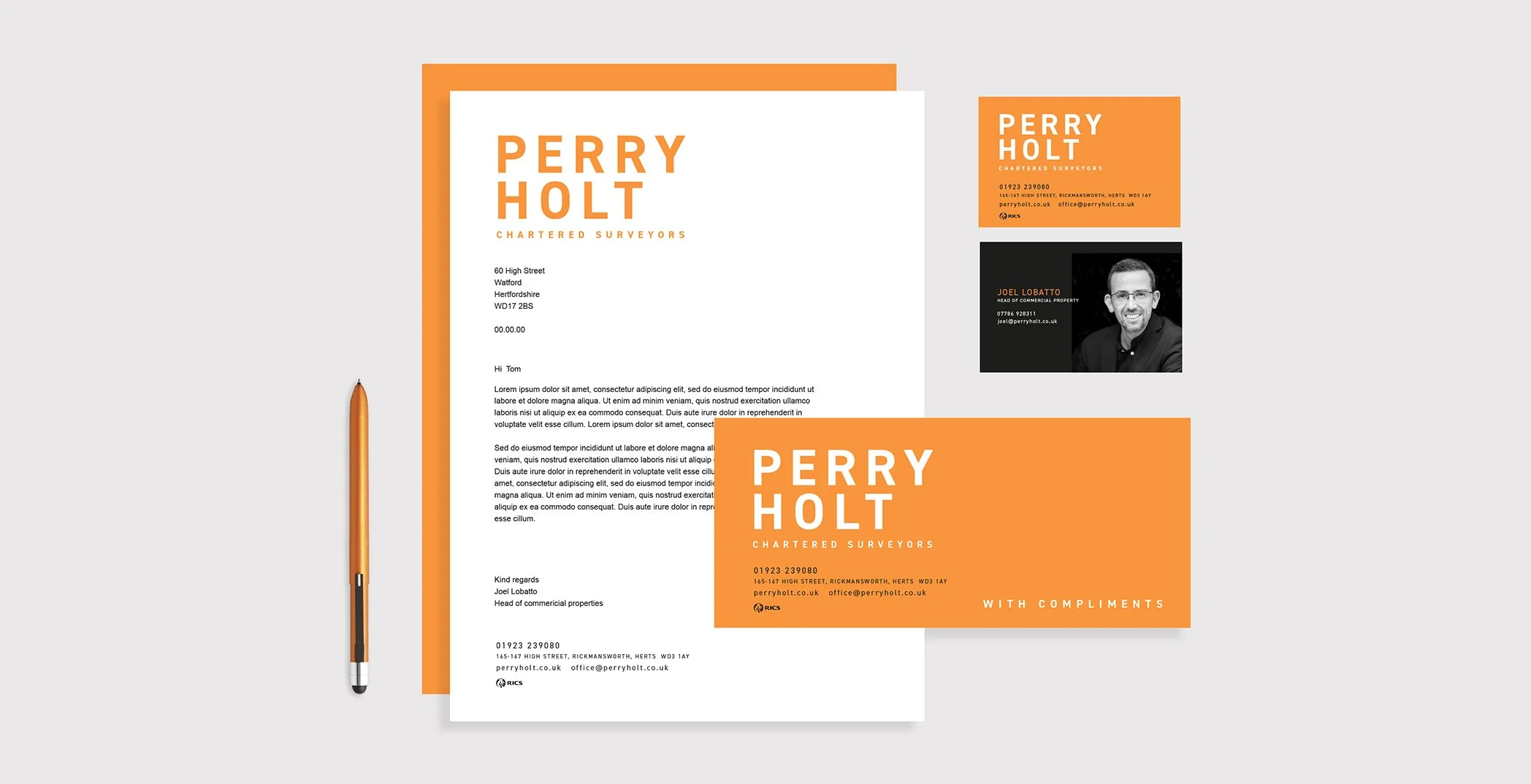 Modern business stationery set with letterhead, business cards, and pen on light background.