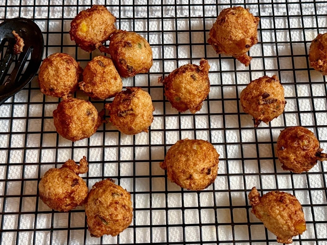 Shrimp balls draining on rack after frying