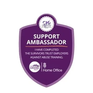 Support Ambassador badge from the Surviving Abuse program, indicating completion of domestic abuse training, with home office designation.