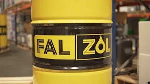 Close-up of a yellow safety barrier with the label 'FAL ZOL' in black text on a black stripe.