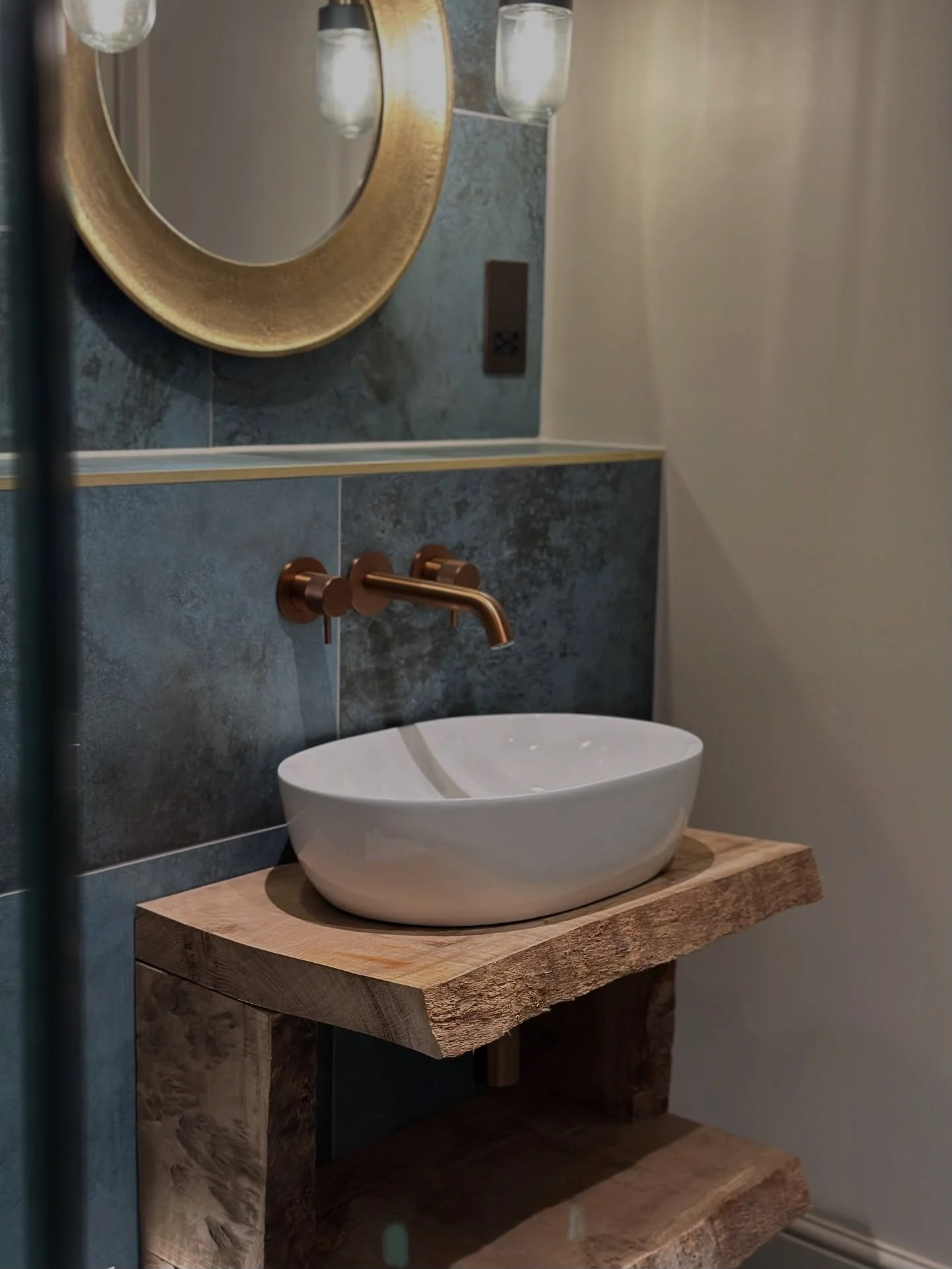 Corners of a beautifully finished bathroom project - brushed bronze features combined with brass tones &amp; wood textures balance this stunning space into an industrial luxe haven! ✨

#bathroomdesign #bathroom #bathroominspo #interiordesign #bathroo
