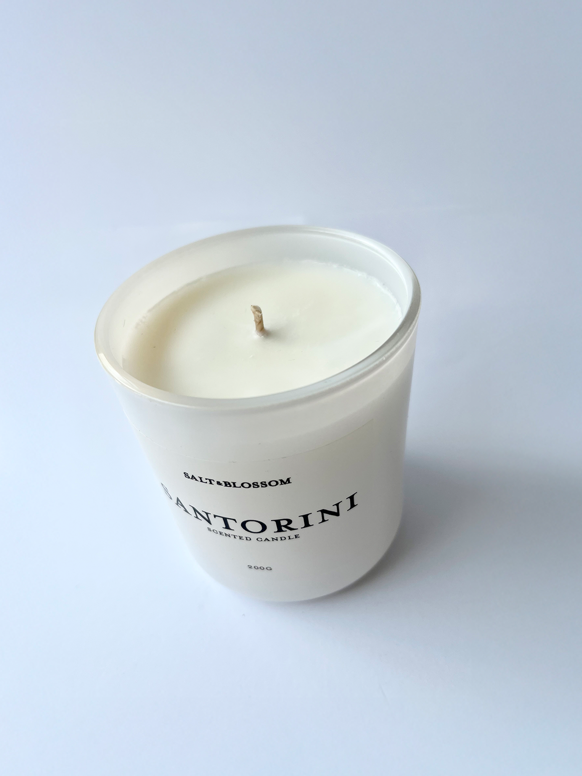 Santorini candle in white jar