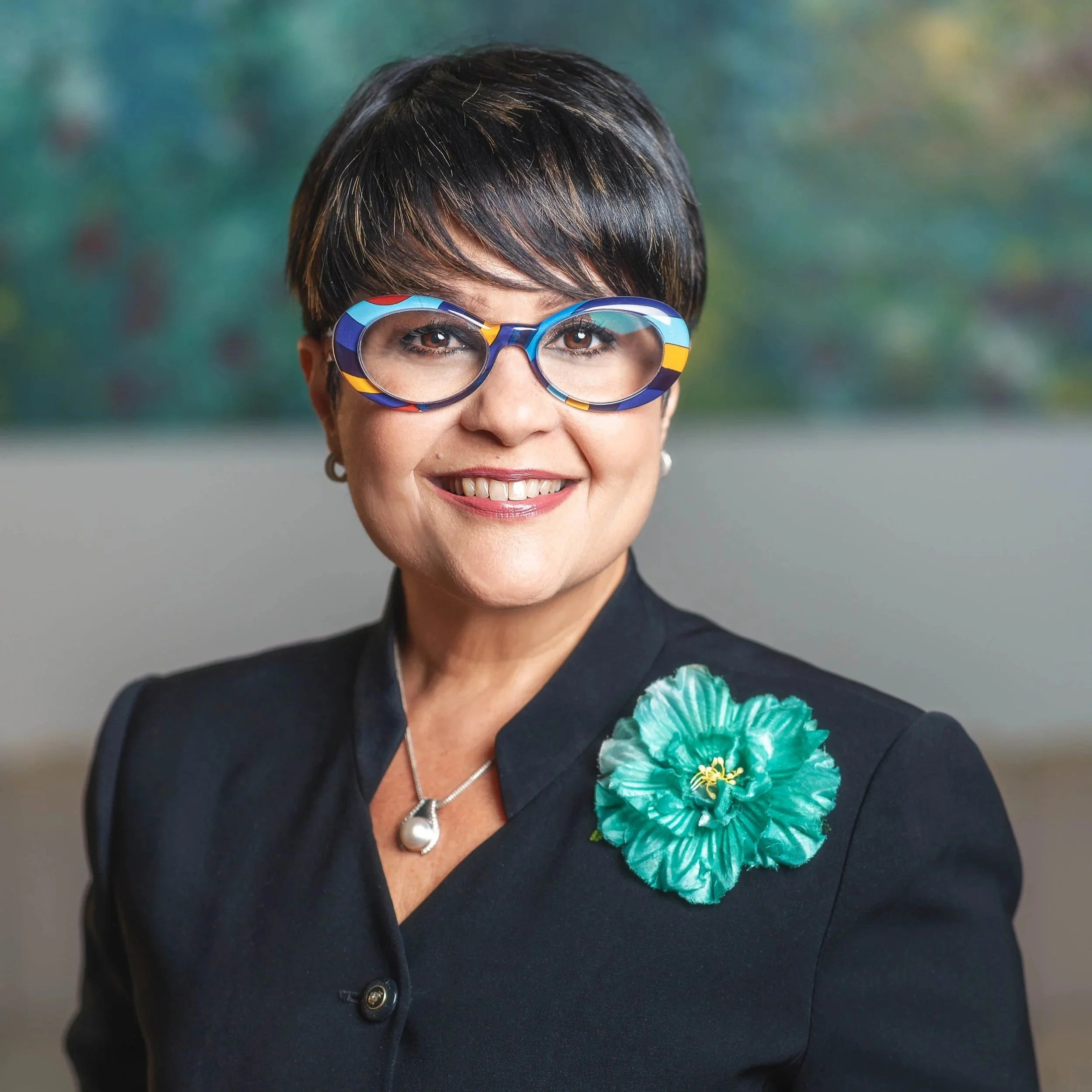 Enid Flores, Esq - Director of Finance & Administration