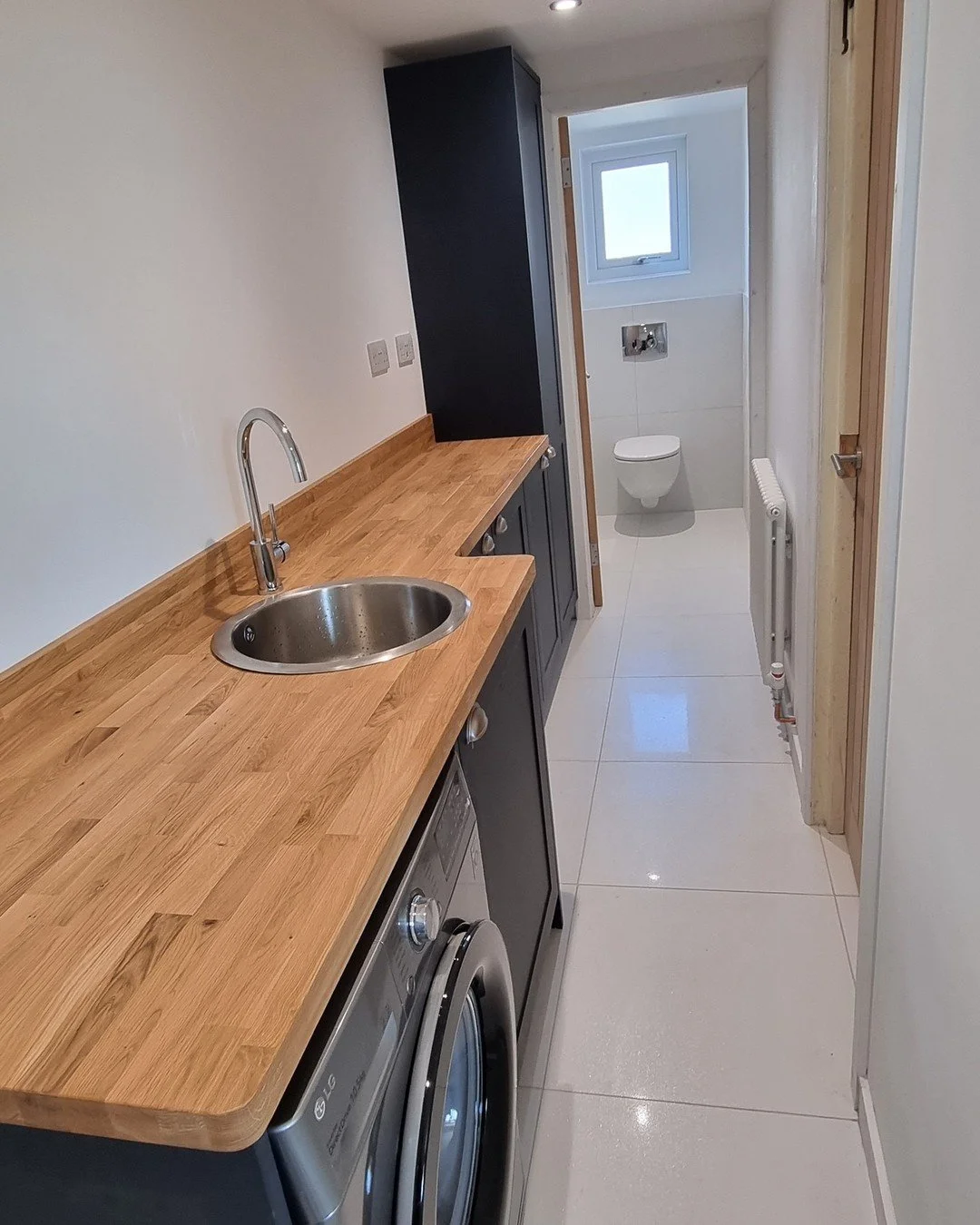 Nostalgic: working in the street I grew up in for a top customer.

Downstairs toilet and utility room rework. 

Electric underfloor heating throughout, fully replastered, floor insulated, screeded and tiled. Wall hung wc and vanity wash hand basin ma