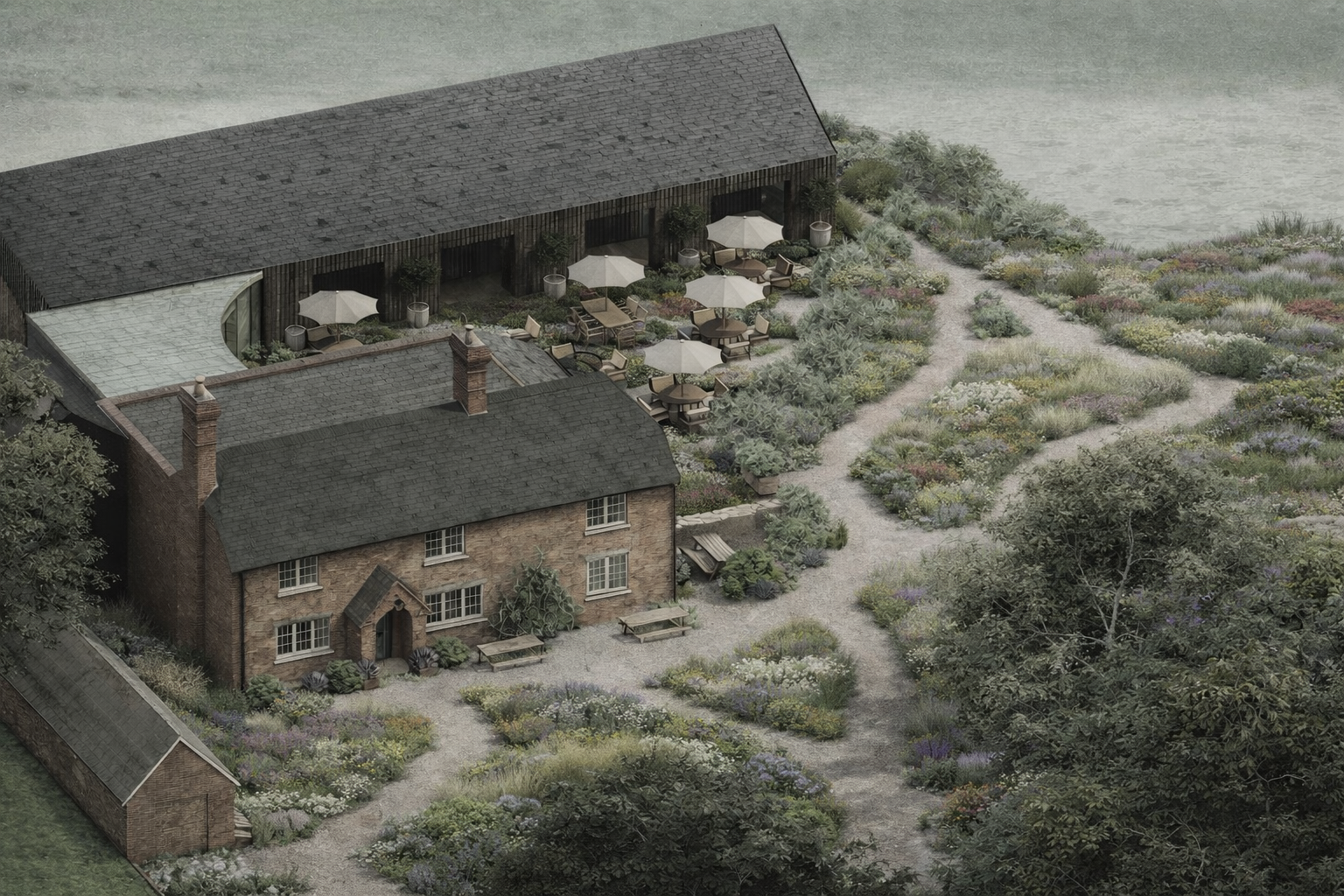 An aerial view of a rustic brick house with surrounding garden and pathways, outdoor seating area with umbrellas, and nearby trees, overlooking a body of water.