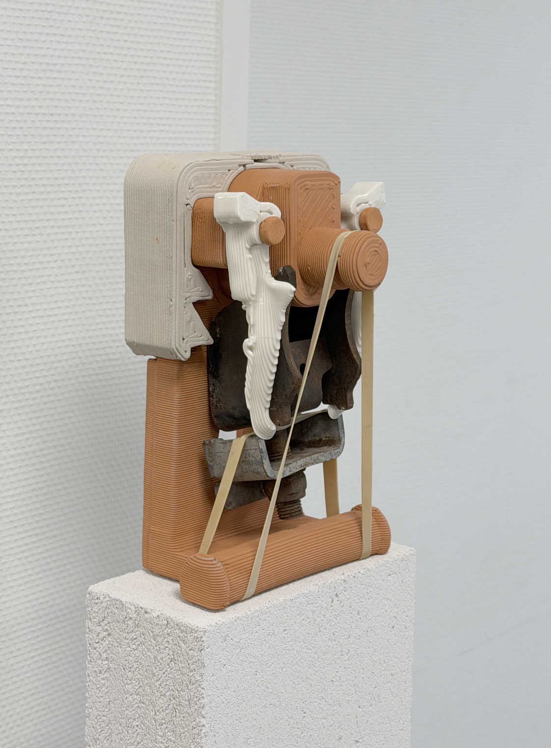 Uģis Albiņš, Belgian red and grey clay, porcelain, lost unknown metal parts, lost rubber band, 2025, belgian red and grey clay, porcelain, lost unknown metal parts, lost rubber band, 25 x 15 x 13cm. 
