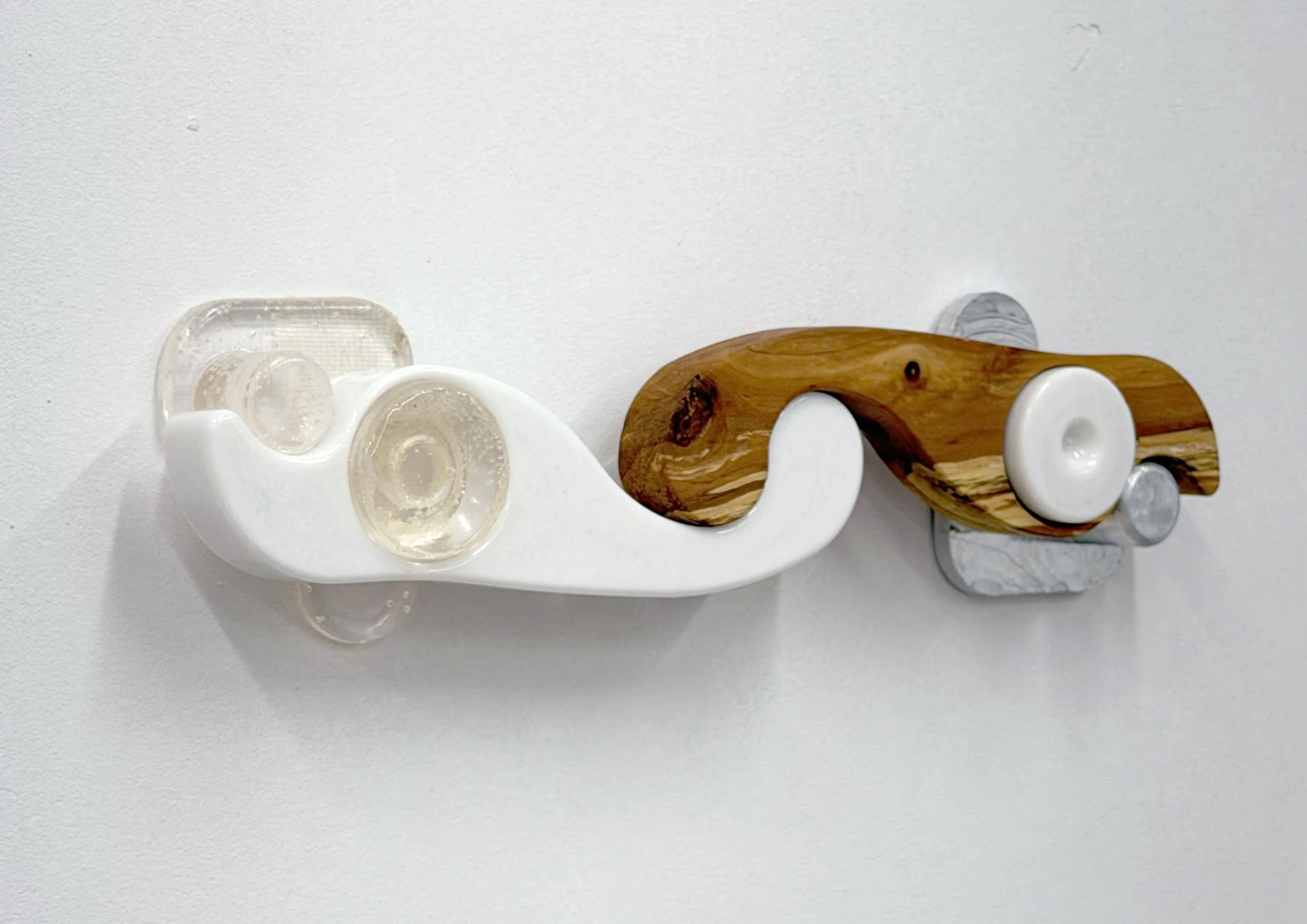 Uģis Albiņš, DHTAAQ #5, 2026, aluminium, apple tree, acrylonitrile butadiene styrene, epoxy resin, 40 x 7 x 6 cm

