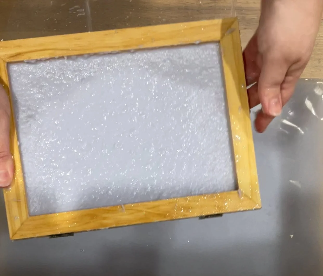 paper pulp coated onto screen