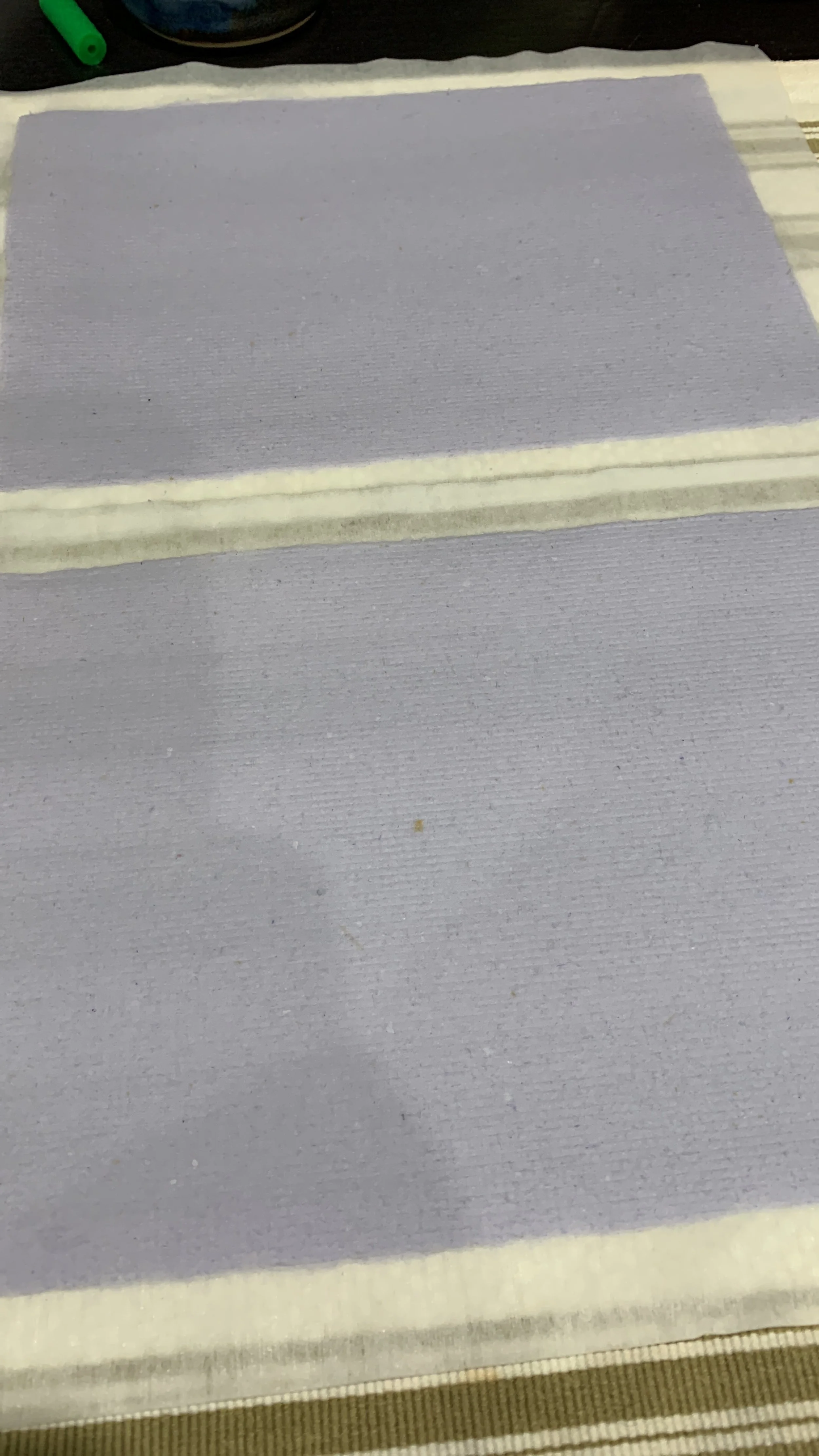 freshly made paper drying out on counter