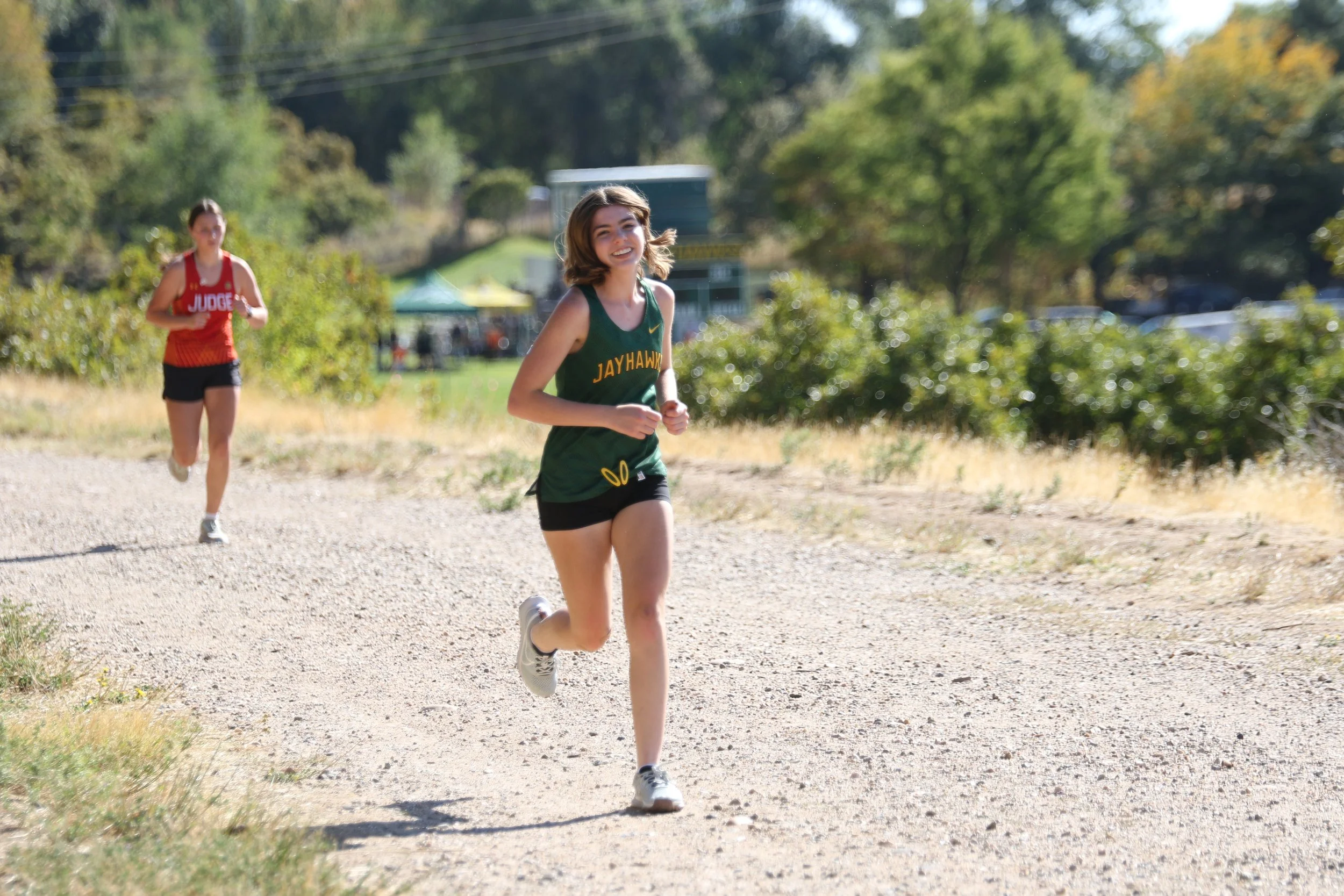 Female student runs for cross country.