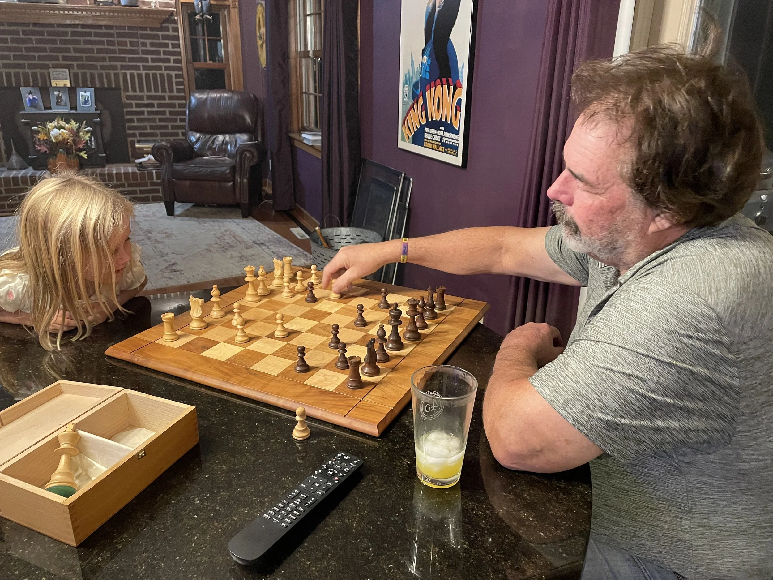 dave teaching granddaughter chess.jpg