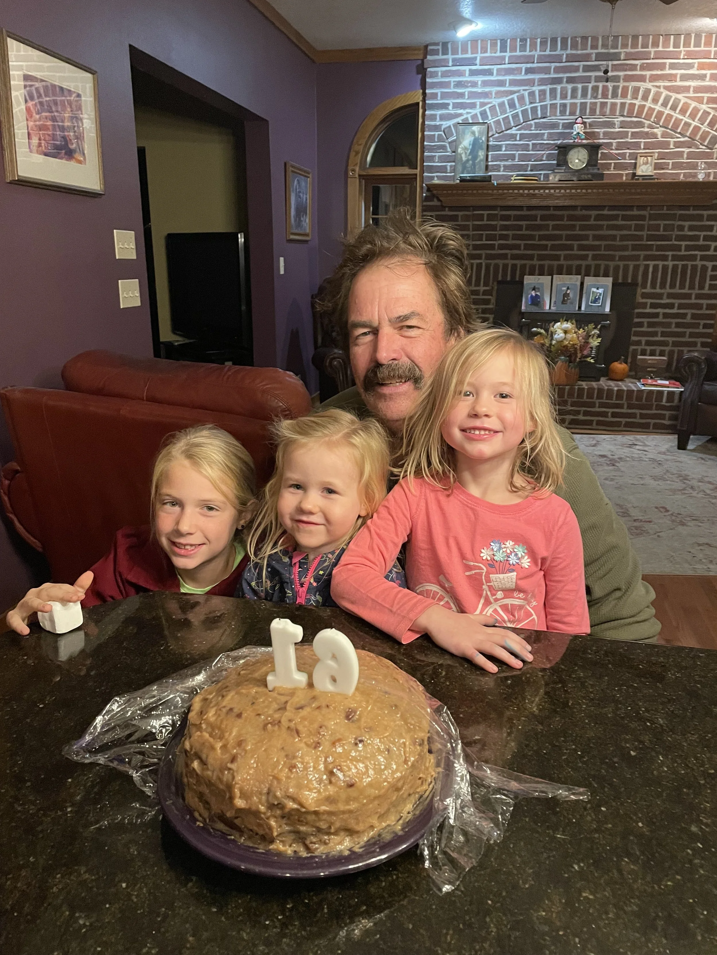 Dave with granddaughters.jpg