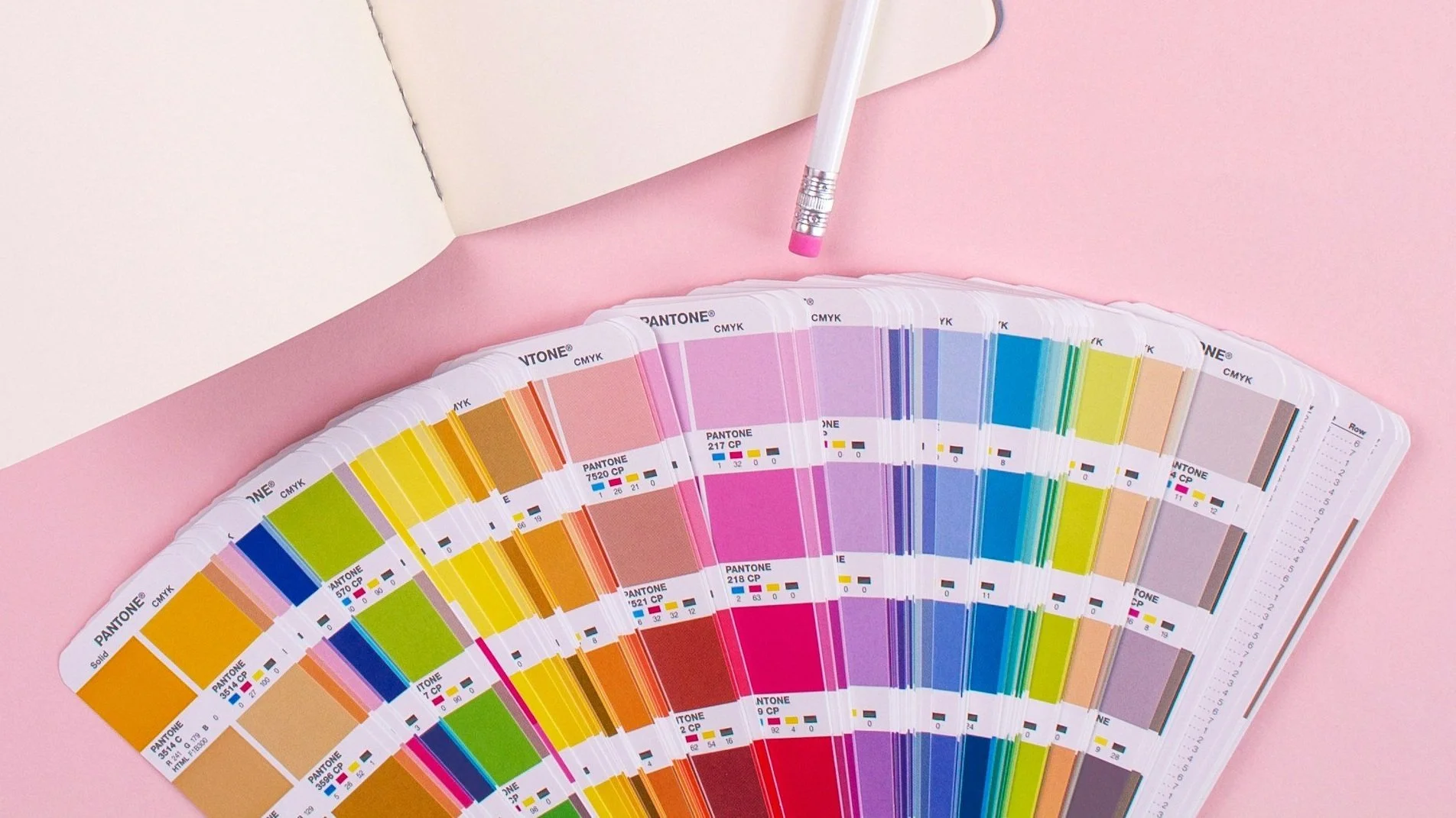 Interior design color palette guide with pink Pantone swatches and pen  inspiration for Austin home remodels