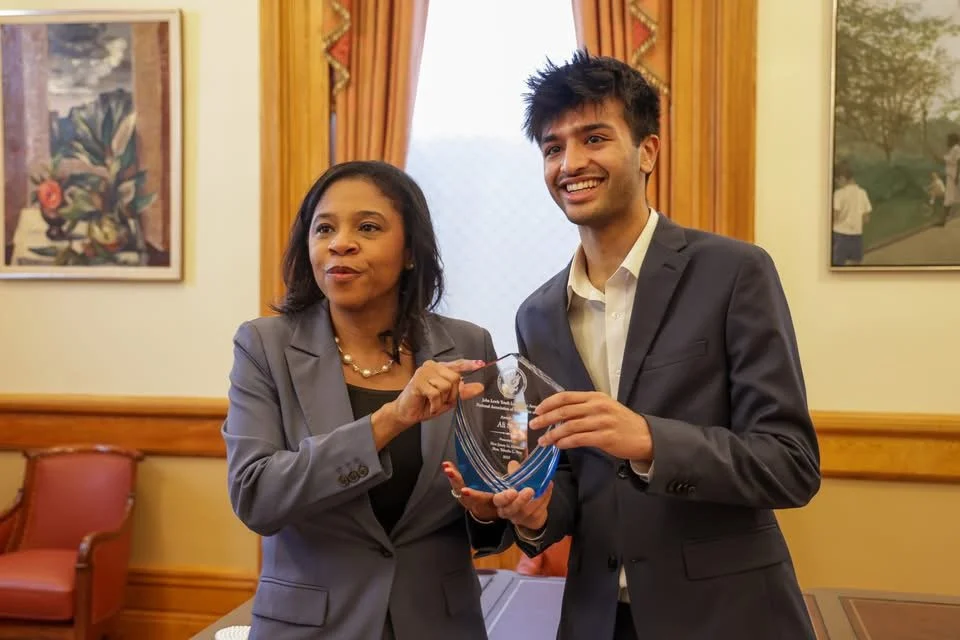 Ali Sabir receives John Lewis Youth Leadership Award from New Jersey Lt Governor Tahesha Way.