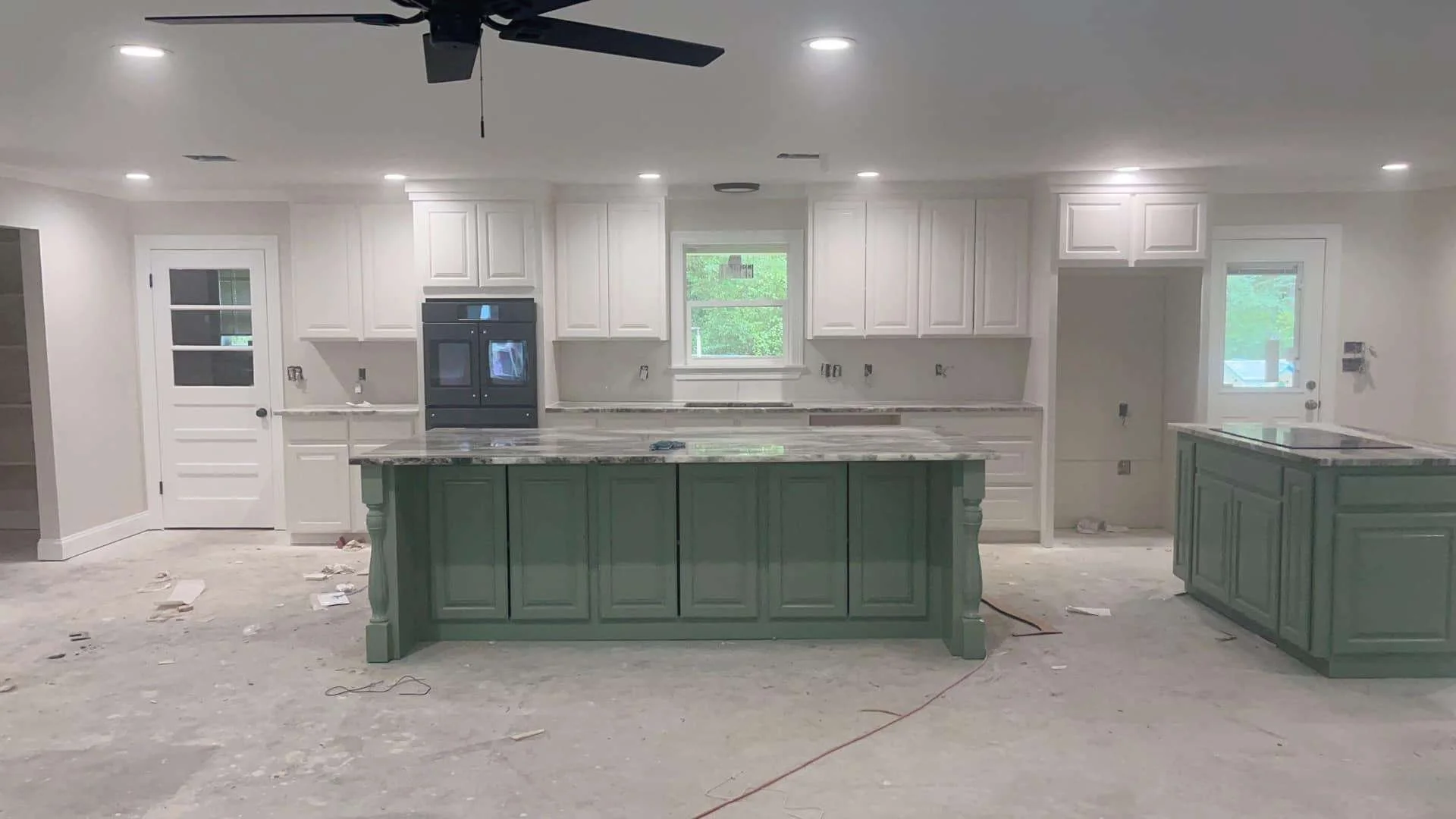 White Raised Panel Perimeter Cabinets/ Sage Green Island/ Fantasy Brown Quartz