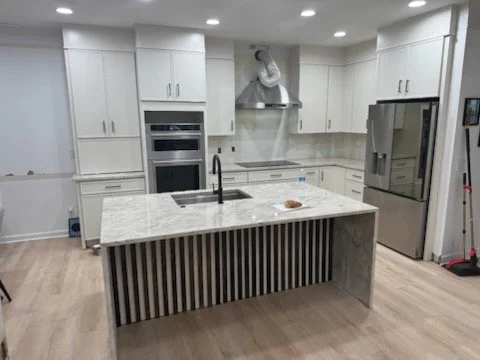 Ivory Slim Shaker/ Taj Mahal Countertops/ Waterfall Edge