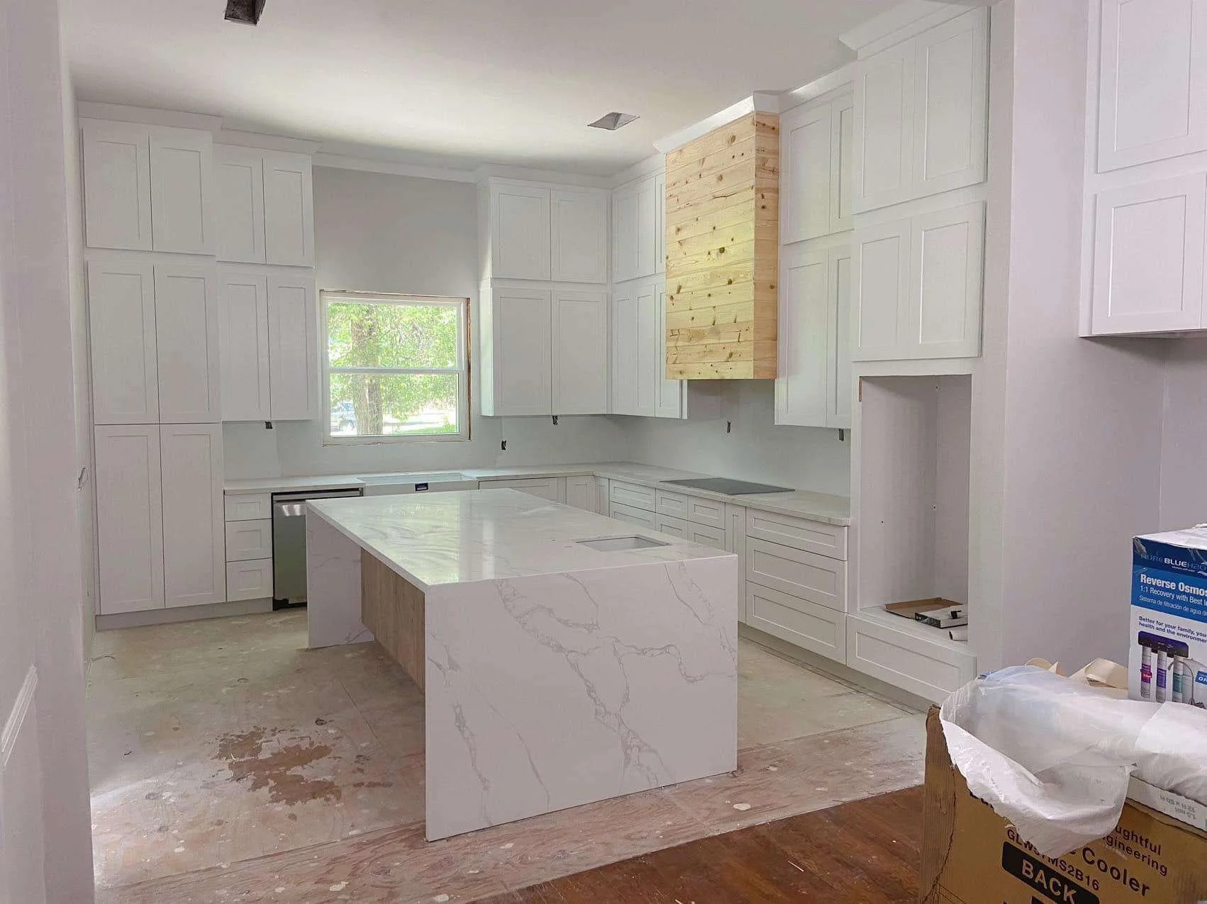 White Shaker Cabinets/ Double Stacked/ Fire Island Quartz/ Waterfall Edge