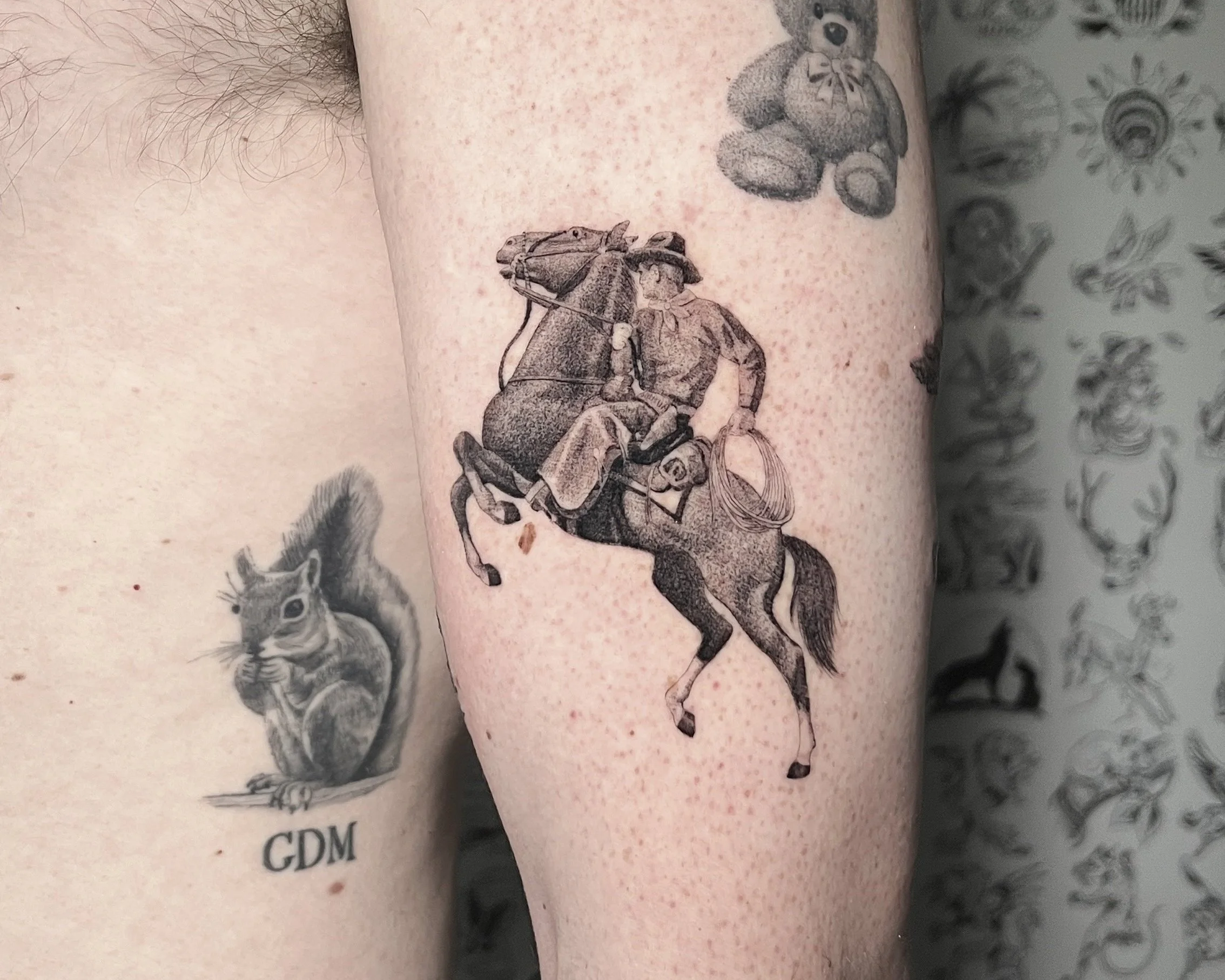 Single needle cowboy on horseback tattoo