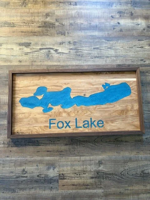 Handcrafted Fox Lake wooden wall sign featuring a blue lake-shaped inlay, natural wood grain, and a dark wood frame.