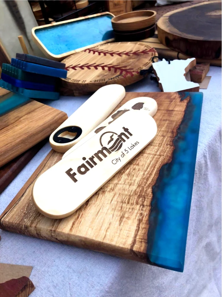 wooden bottle openers with "Fairmont" engraved on it