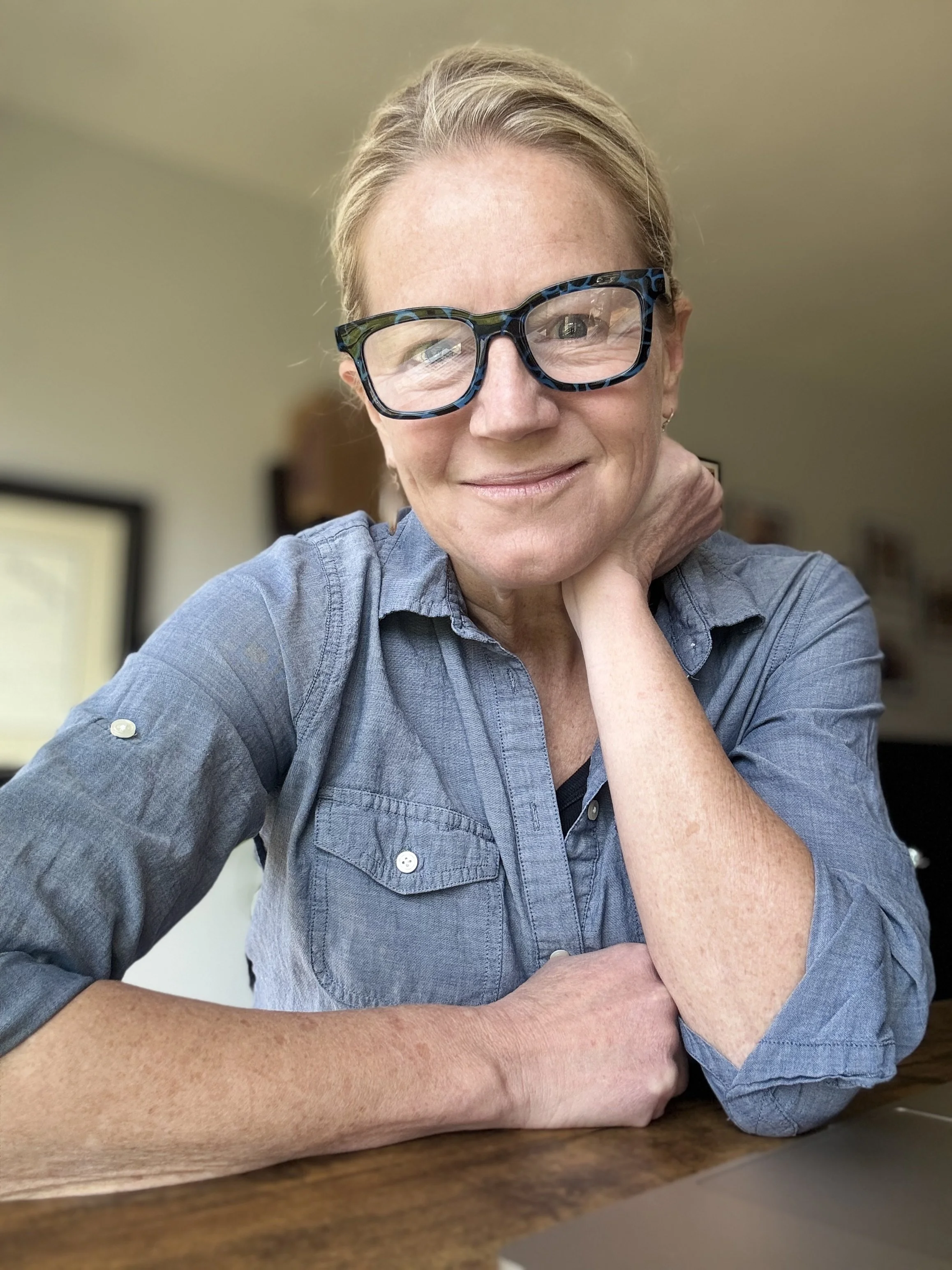 Headshot glasses arm.jpg