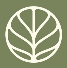 White leaf design inside a circle on an olive green background
