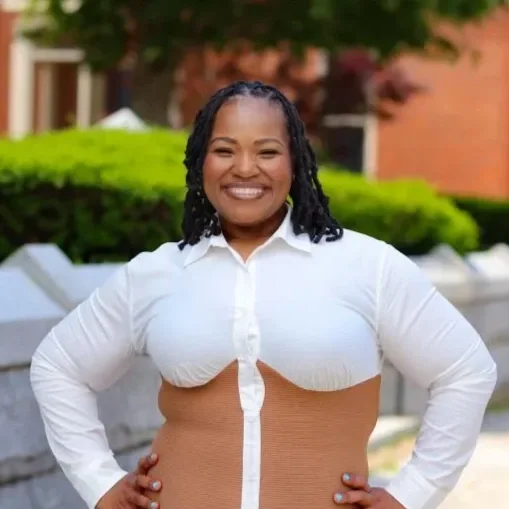 Photo of Tenay Taylor with hands on her hips