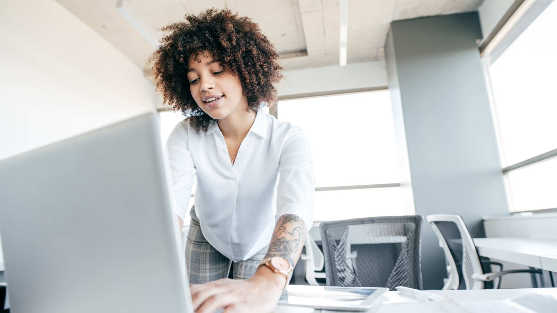 woman in white shirt in office